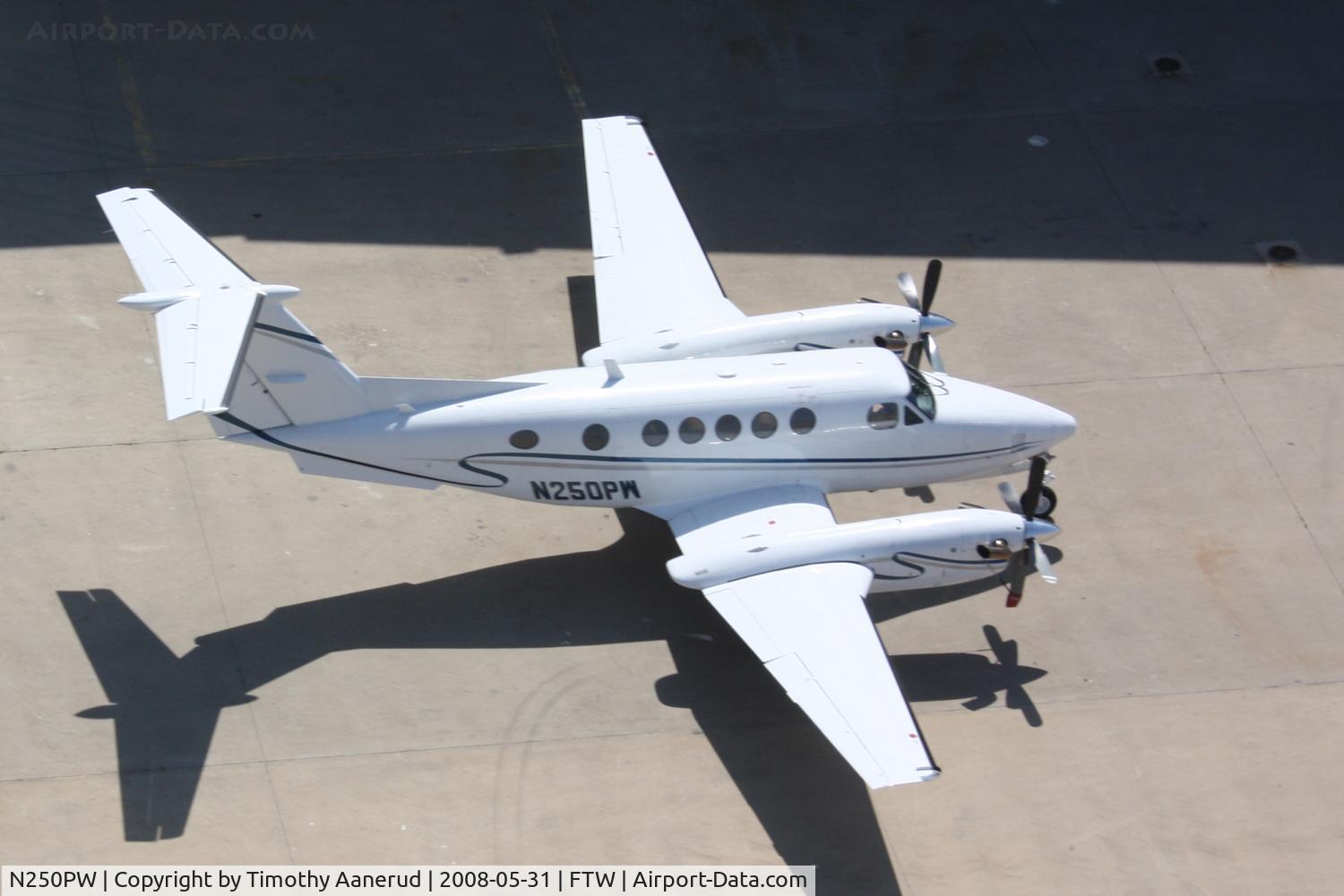 N250PW, 1982 Beech B200 King Air C/N BB-1058, On the ramp at FTW.  Photo taken while riding in a Huey