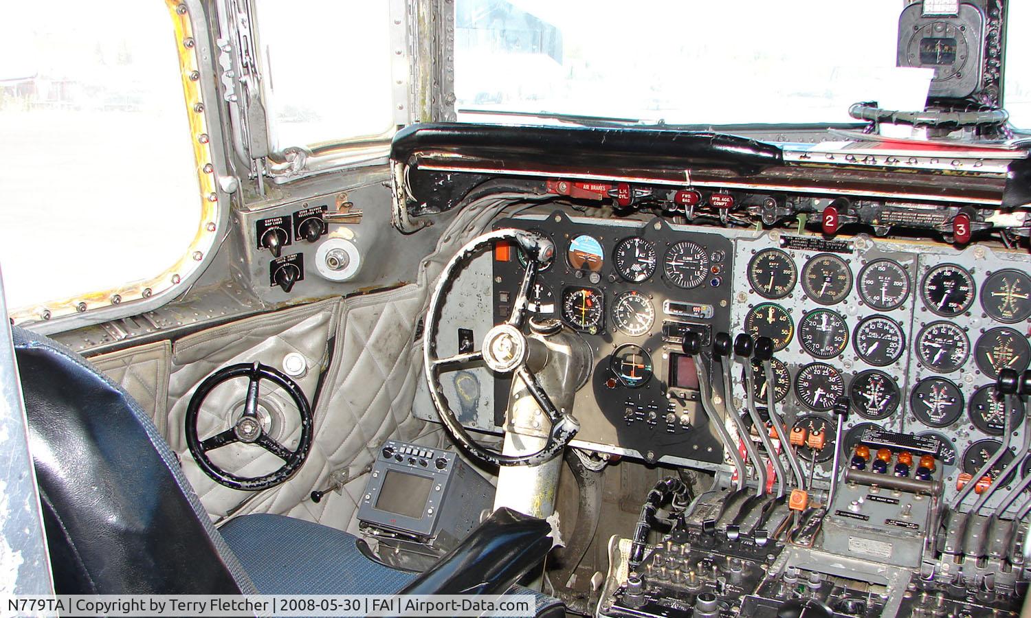 N779TA, 1958 Douglas DC-6A/C C/N 45529, A view inside the cockpit of this classic airliner