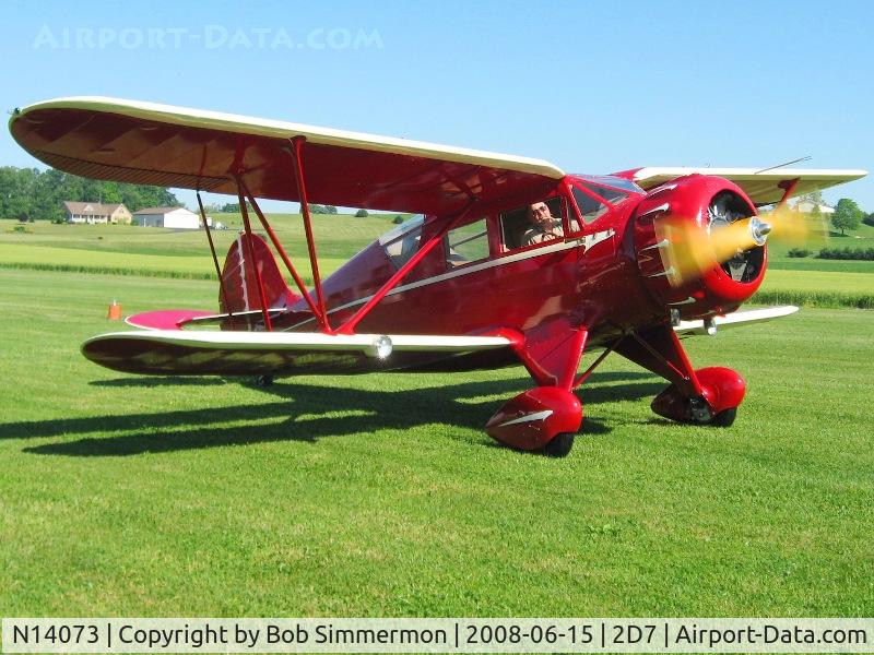 N14073, 1934 Waco YKC C/N 3990, Taxiing out to departure requires alternately gawking out each side to see where you're going.  Beach City Father's Day fly-in.