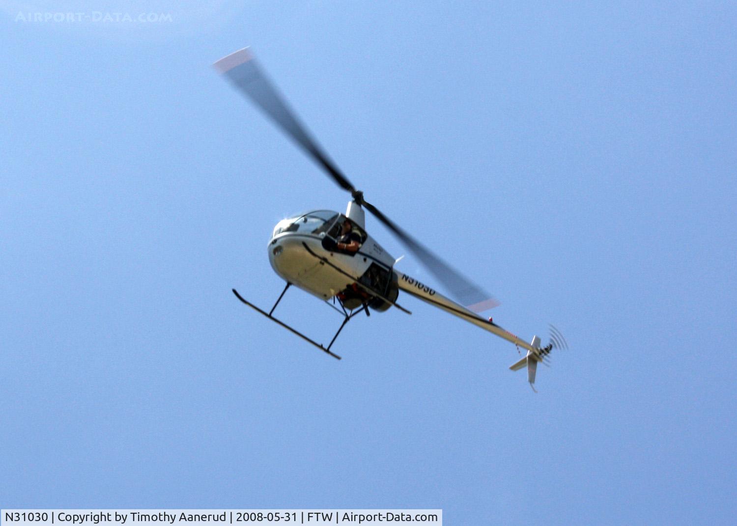 N31030, 2006 Robinson R22 Beta C/N 4059, Flying past the Cowtown Warbird Roundup