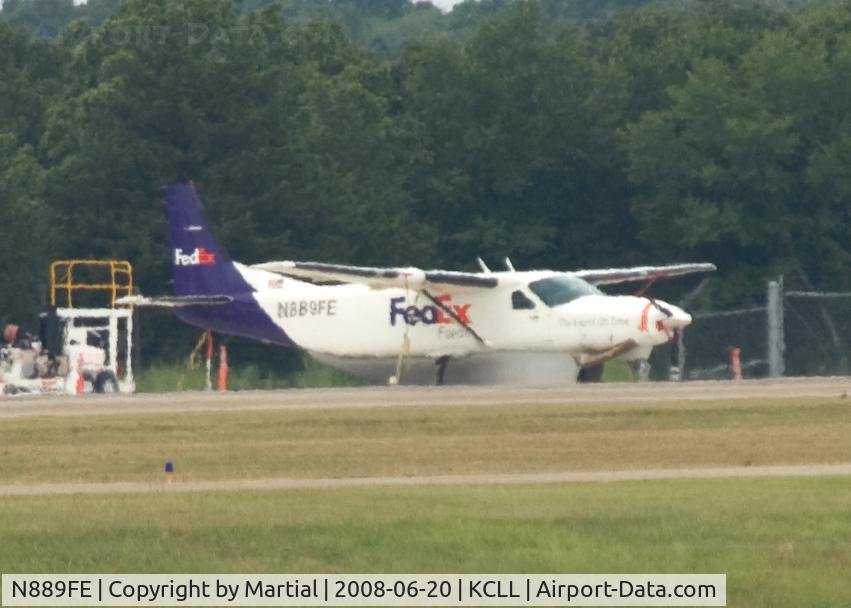 N889FE, 1990 Cessna 208B C/N 208B0218, parked across the field from me at CLL.  Really bad picture.