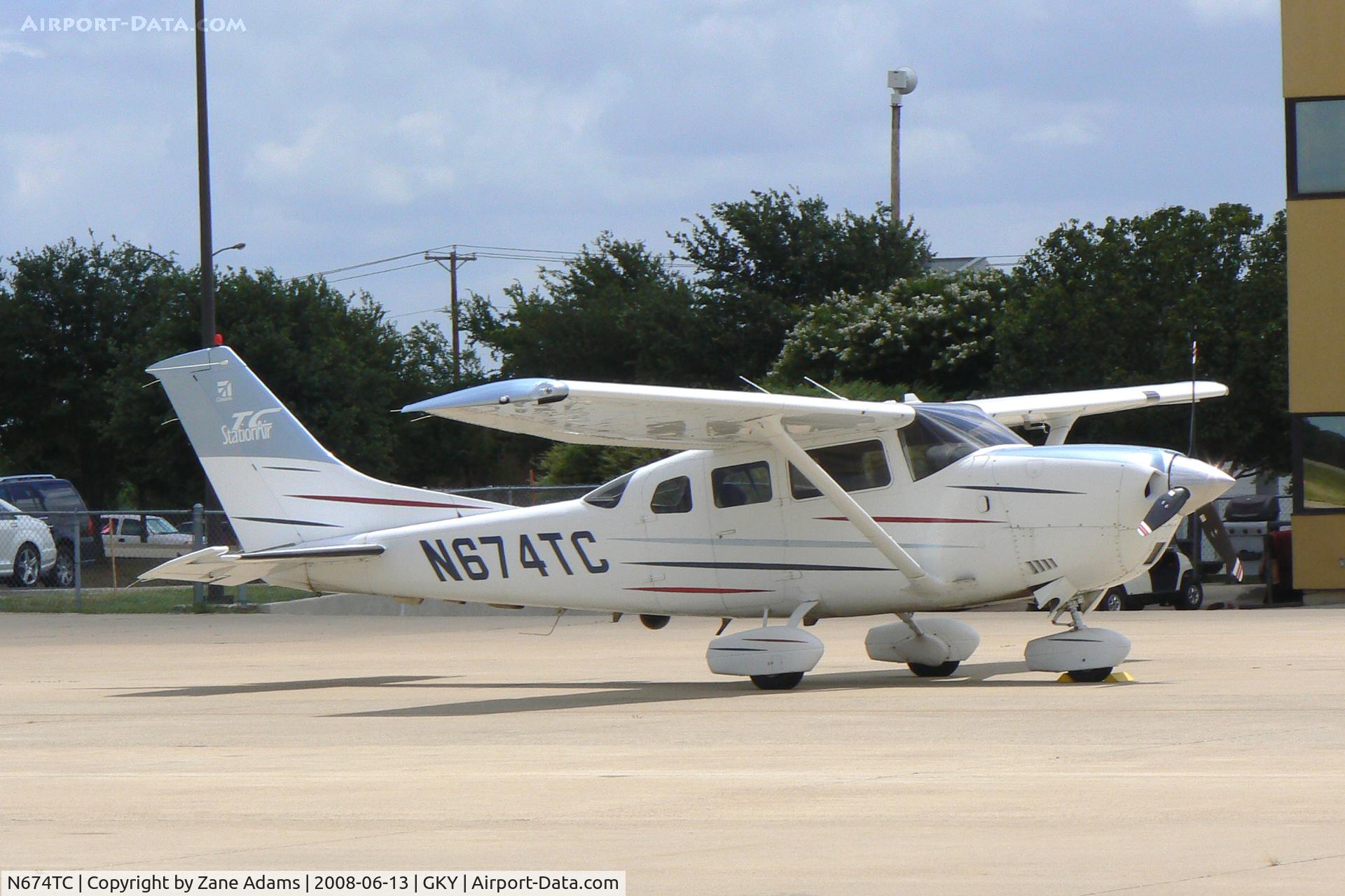 N674TC, 2003 Cessna T206H Turbo Stationair C/N T20608380, At Arlington Municipal - Notice camera on left side.