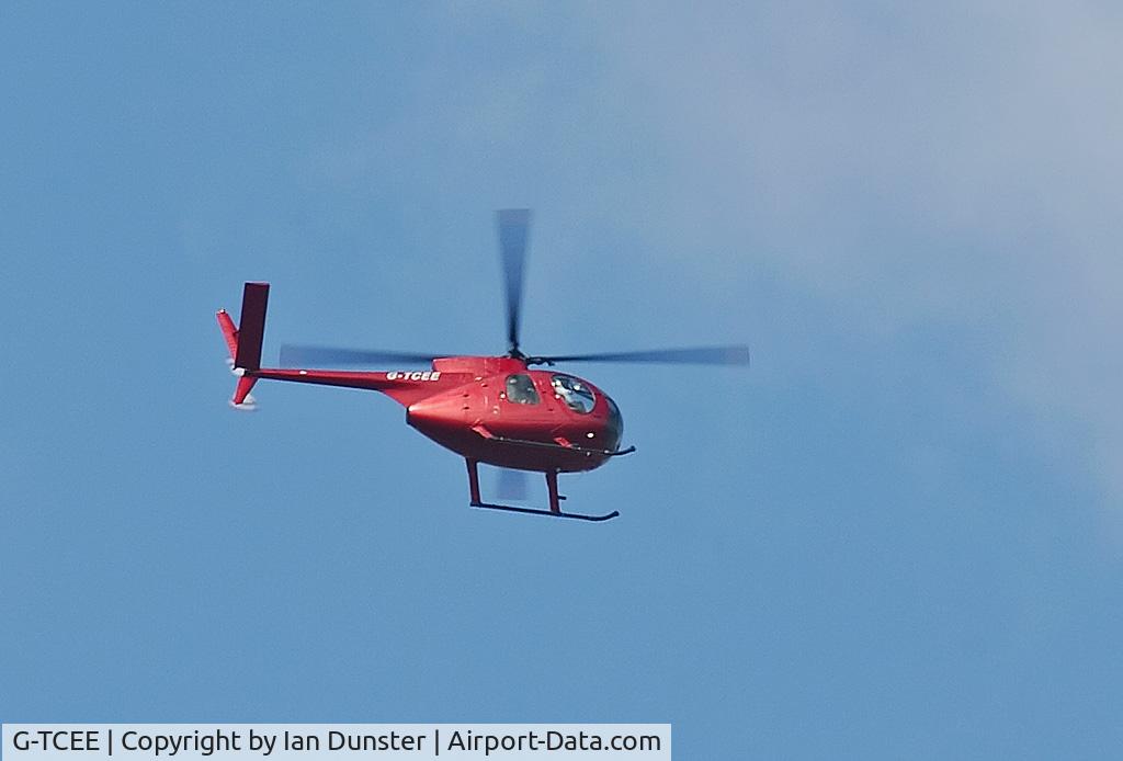 G-TCEE, 1971 Hughes 369HS C/N 610326S, A/C seen overflying photographer's house