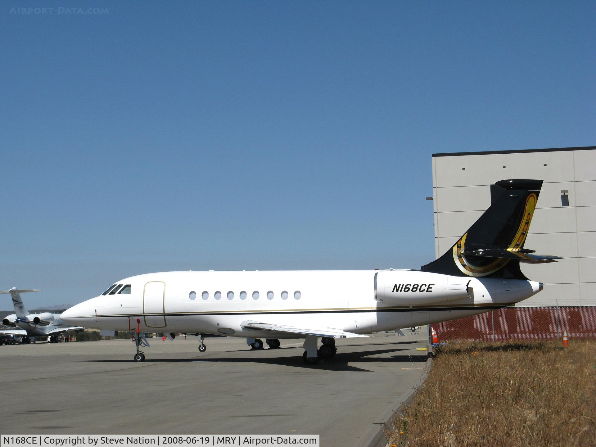 N168CE, 1999 Gulfstream Aerospace G-V C/N 568, 2006 Dassault FALCON 2000EX with colorful tail markings @ Monterey Peninsula Airport