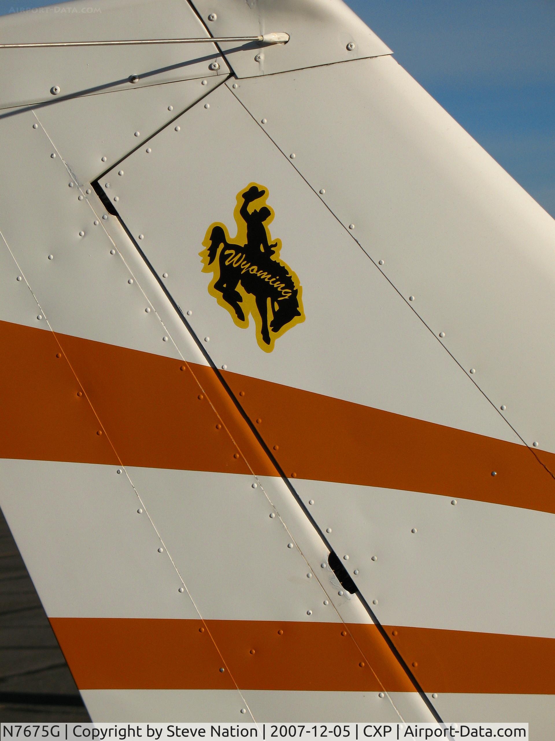N7675G, 1973 Cessna 150L C/N 15074713, Close-up 1973 Cessna 150L with Wyoming cowboy tail logo @ Carson City, NV