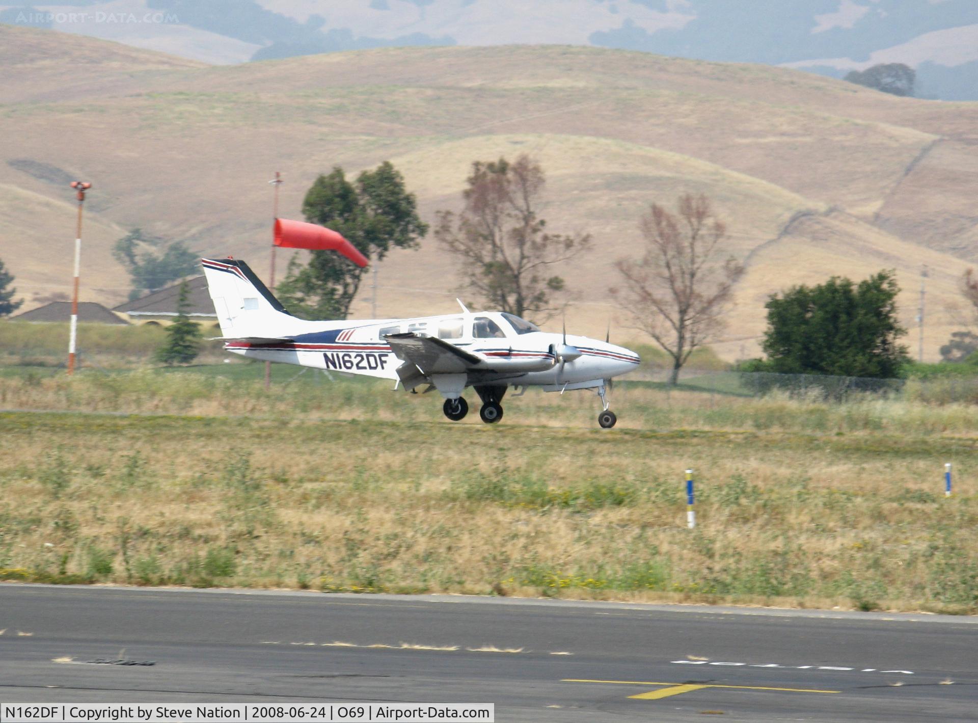 N162DF, 1982 Beech 58P Baron C/N TJ-403, 1982 Beech 58P touching down in smoky haze conditions @ Petaluma, CA
