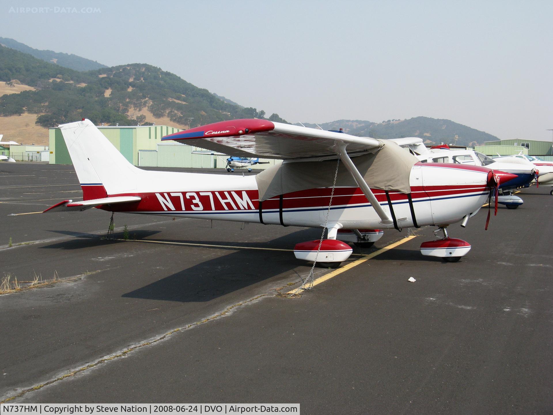 N737HM, 1977 Cessna 172N C/N 17269430, 1977 Cessna 172N with cover in very hazy conditions @ Novato-Gnoss Field, CA