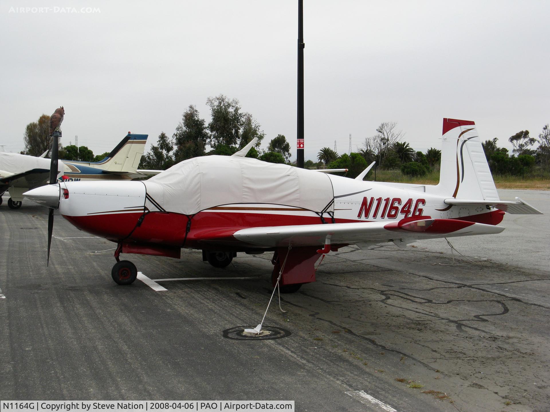N1164G, 1982 Mooney M20K C/N 25-0677, 1982 Mooney Aircraft Corp. M20K with fake owl on prop (wonder if it works?!) @ Palo Alto, CA