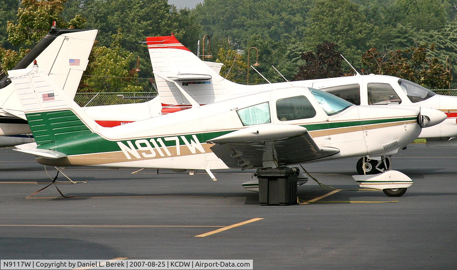 N9117W, 1966 Piper PA-28-235 C/N 28-10729, A 1966 Cherokee tries to blend in with its stablemates.