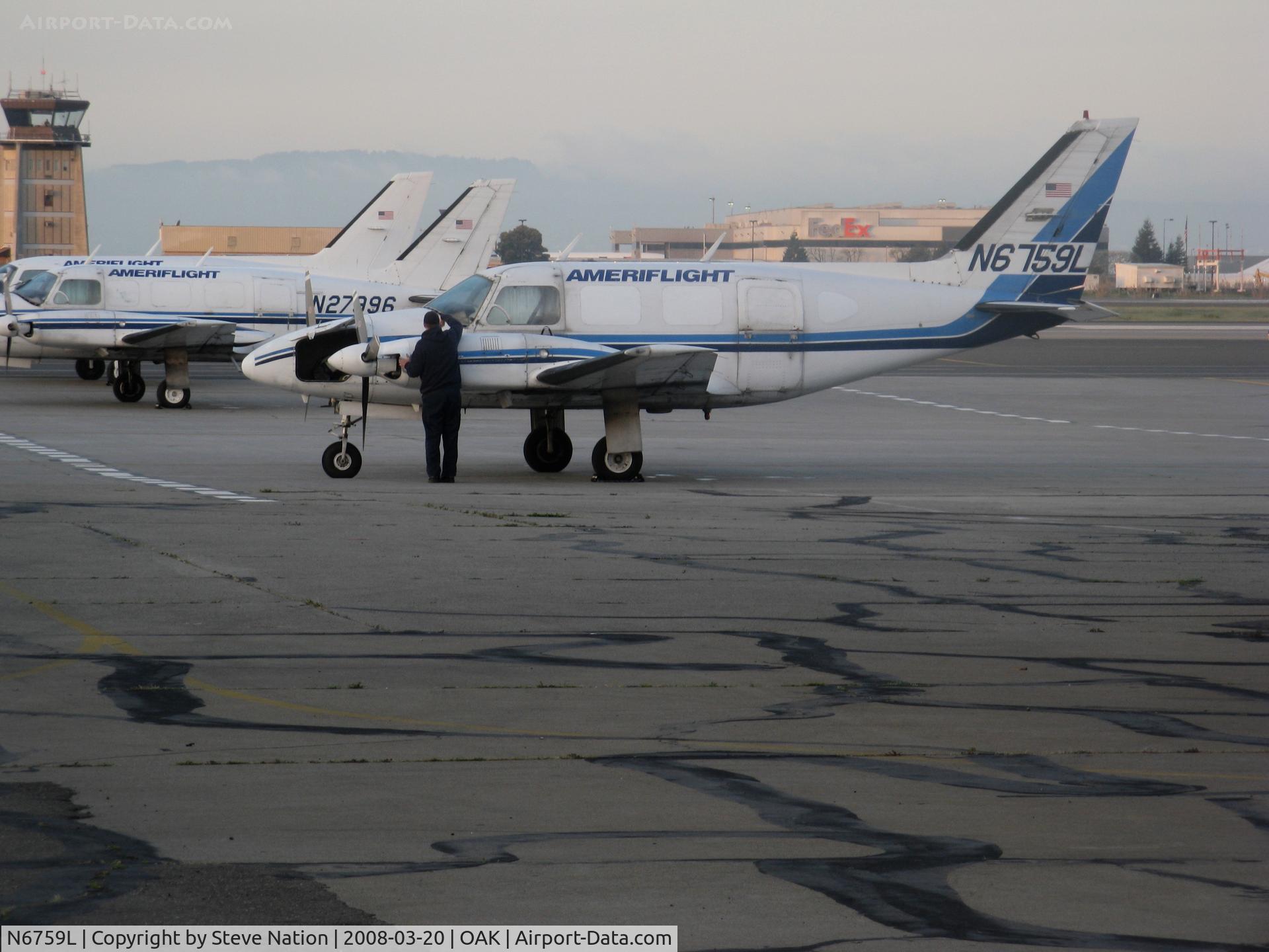 N6759L, 1970 Piper PA-31-310 Navajo C/N 31-661, Early morning shot of Ameriflight 1970 piper PA-31-310 freighter getting windshield wiped  @ Oakland, CA