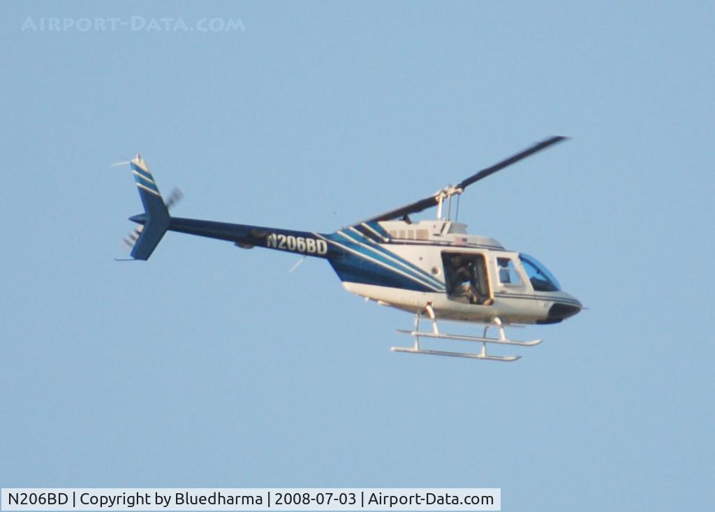 N206BD, 1992 Bell 206B JetRanger III C/N 4203, Not sure what he was doing. Looks like he was taking pictures at Columbine High School.