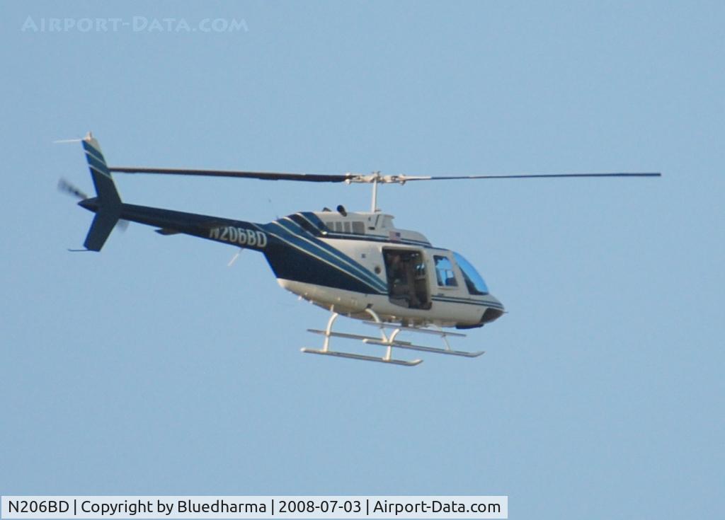 N206BD, 1992 Bell 206B JetRanger III C/N 4203, Not sure what he was doing. Looks like he was taking pictures at Columbine High School.