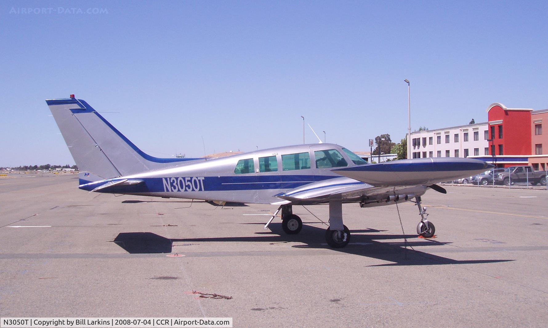 N3050T, 1964 Cessna 320C Skyknight C/N 320C0050, Crowne Plaza airport hotel on right.
