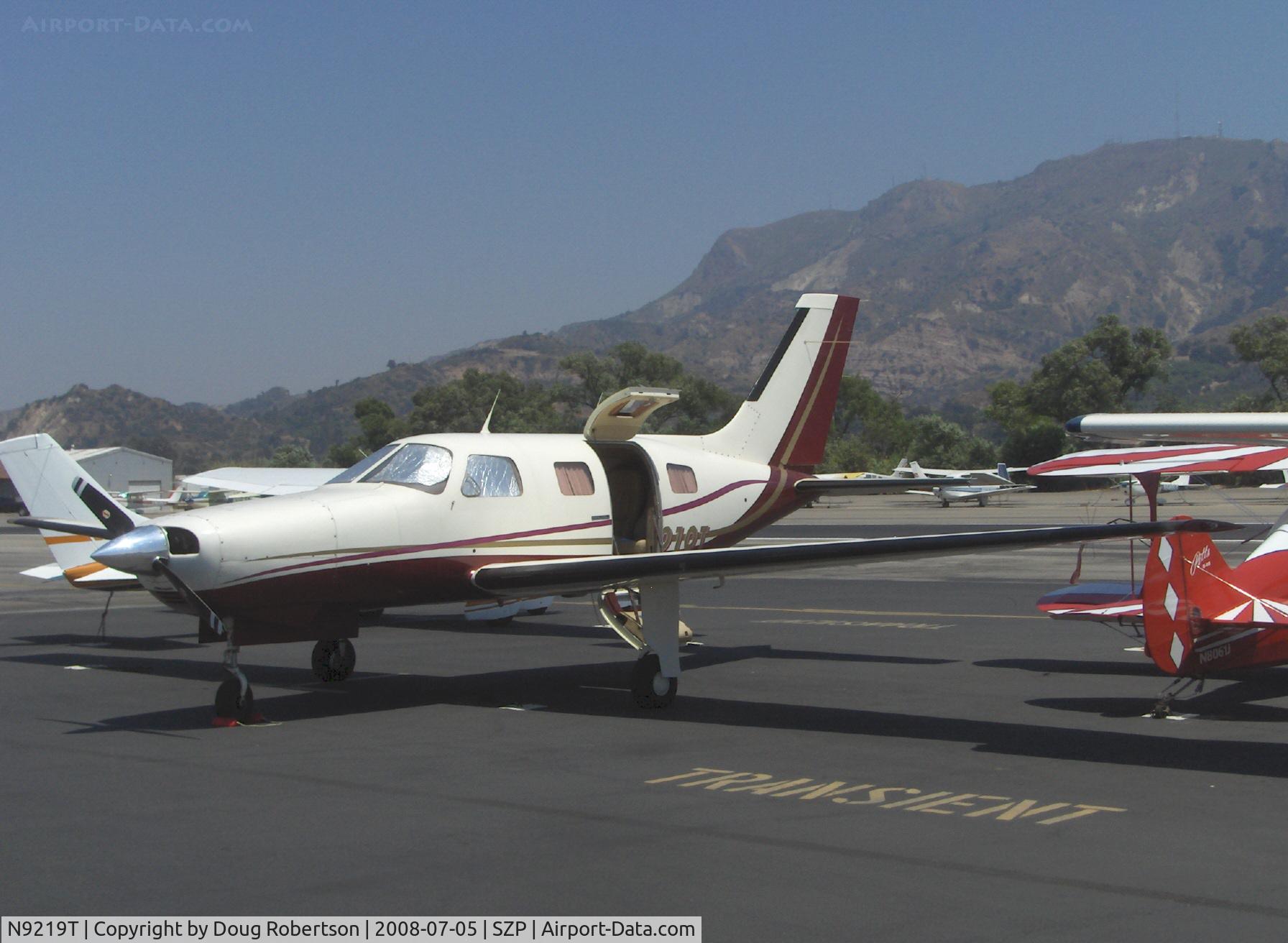 N9219T, 1985 Piper PA-46-310P Malibu C/N 46-8608015, 1985 Piper PA-46-310P MALIBU, Continental TSIO-520 310 Hp, turbocharged & pressurized. Airstair door open on a 90 degree F day
