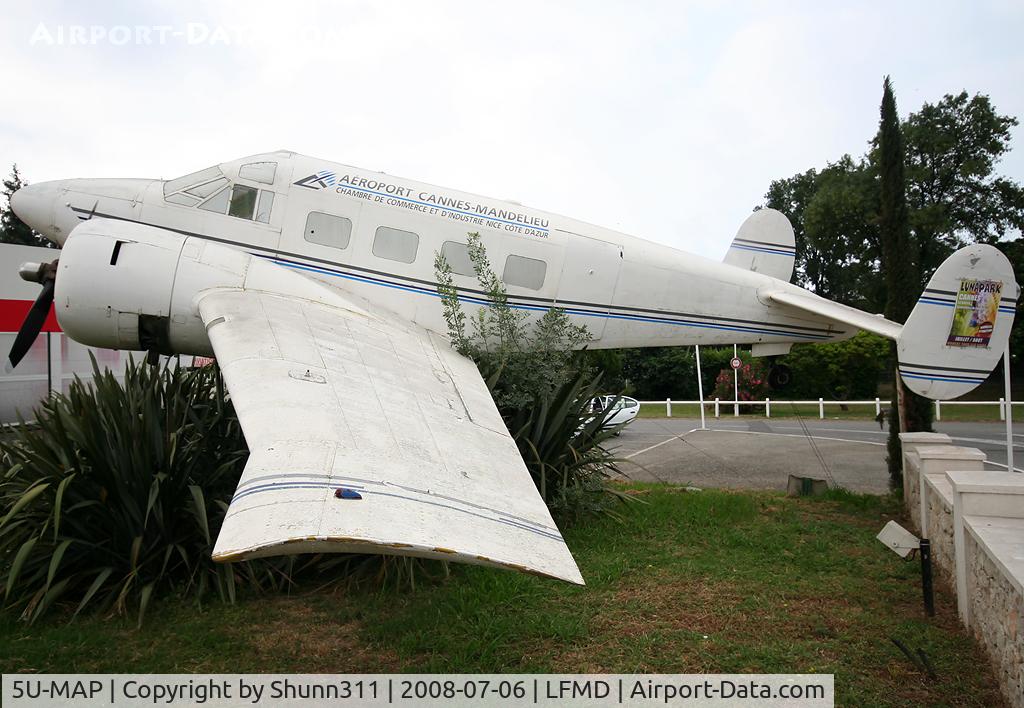 5U-MAP, Beech E-18S C/N BA-184, Preserved at the entrance of the Airport without registration... Ex. Niger Air Force with c/n BA-184