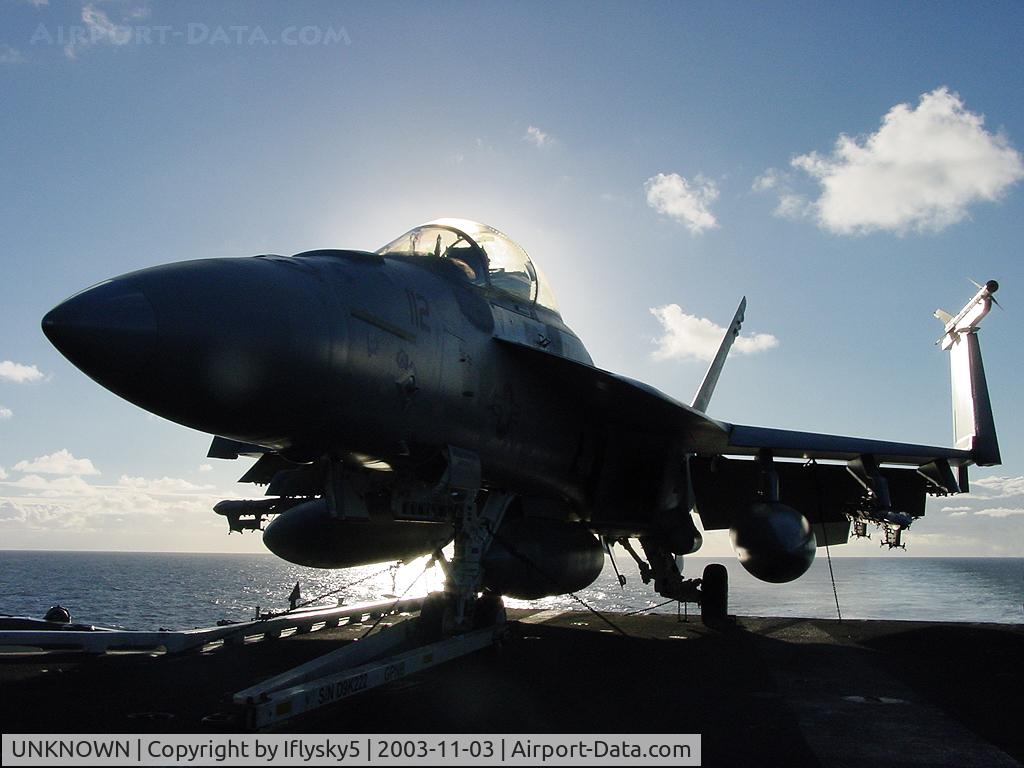 UNKNOWN, , US Navy FA-18 chocked on the fantail of the Nimitz @ sunset