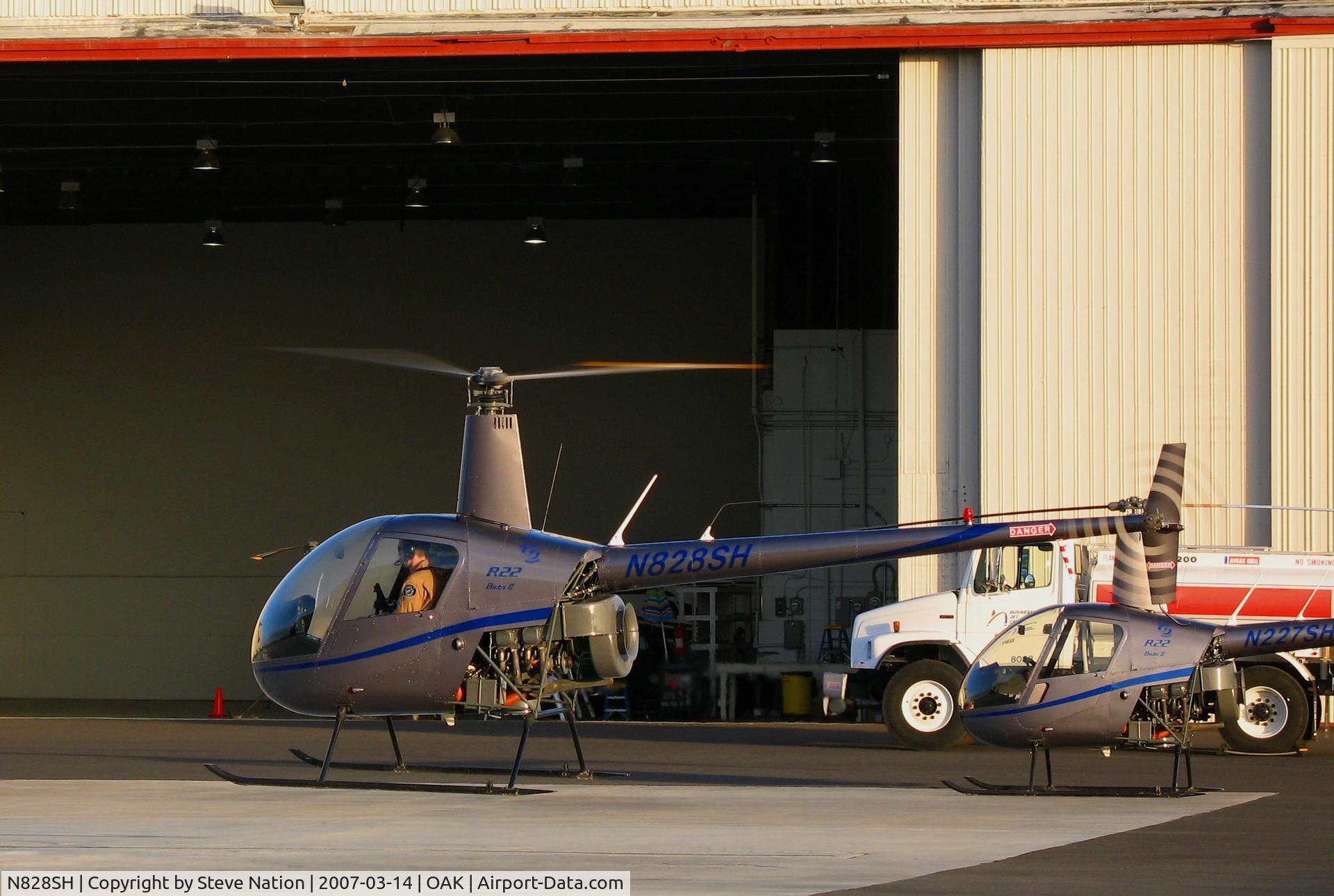 N828SH, 2005 Robinson R22 Beta C/N 3786, Lift-off sequence of now defunct Silver State Helicopters 2005 Robinson Helicopter R22 BETA crew training in late afternoon sun @Oakland, CA