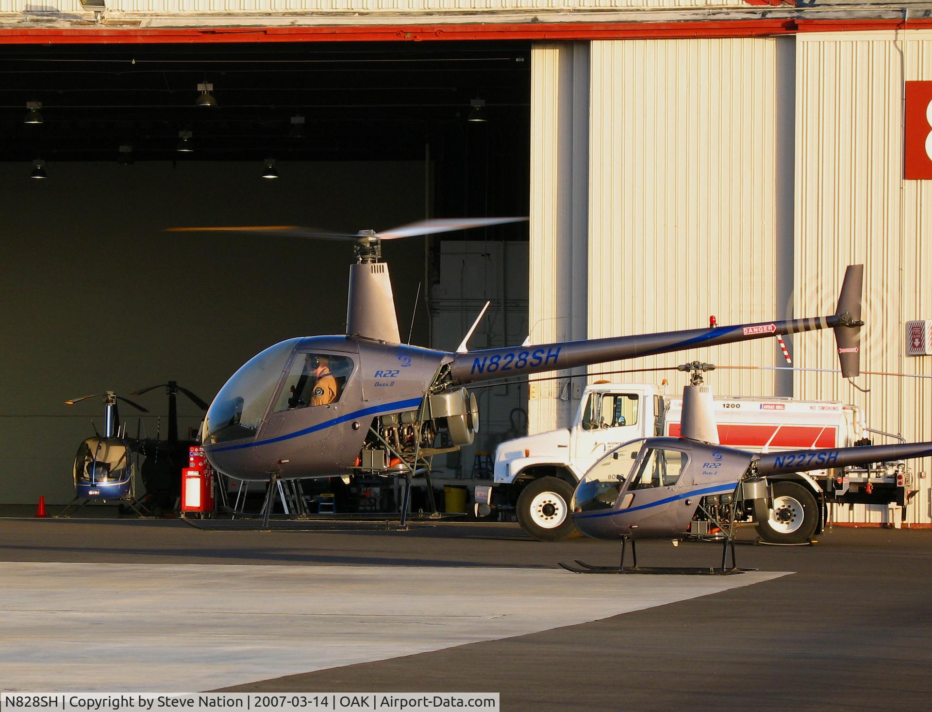 N828SH, 2005 Robinson R22 Beta C/N 3786, Lift-off sequence of now defunct Silver State Helicopters 2005 Robinson Helicopter R22 BETA crew training in late afternoon sun @Oakland, CA
