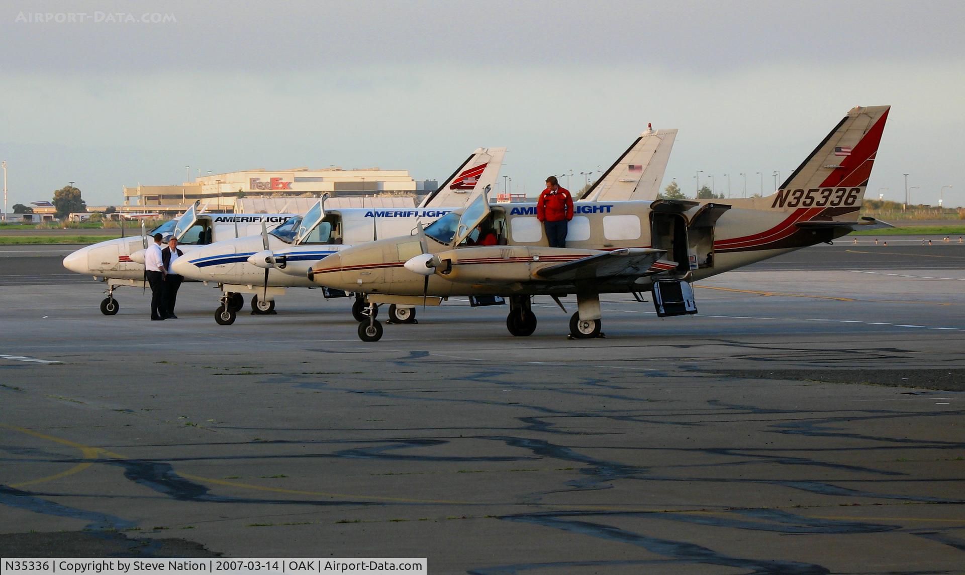 N35336, 1979 Piper PA-31-350 Chieftain C/N 31-7952189, (Odd-ball colors) Ameriflight 1979 Piper PA-31-350 freighter with her 'sisters' in late afternoon sun @Oakland, CA