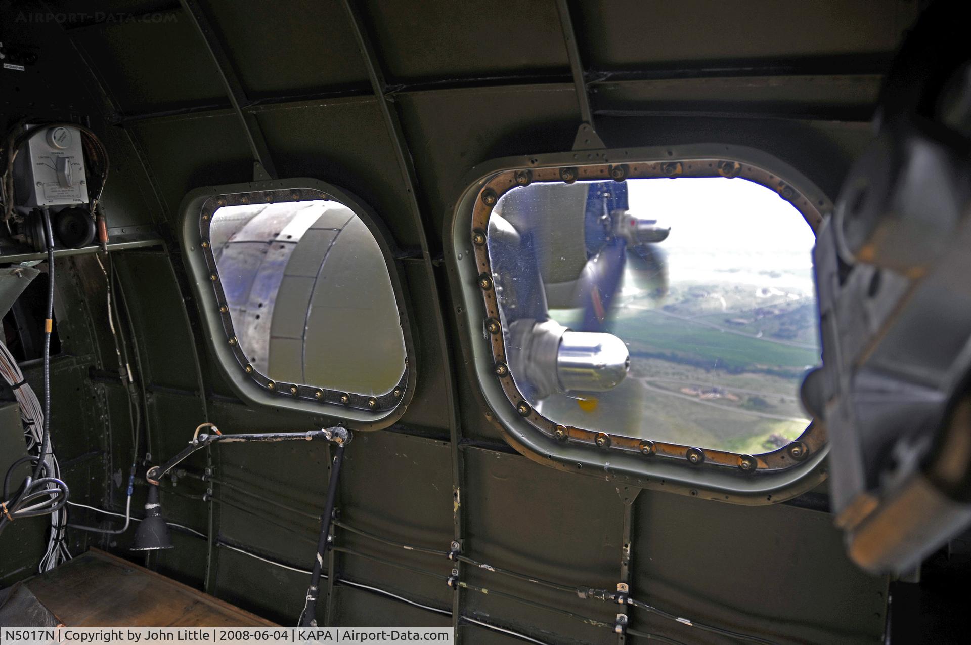 N5017N, 1944 Lockheed/Vega (Boeing) B-17G-105-VE Flying Fortress C/N 8649, Seated behind the bombardier position, looking out