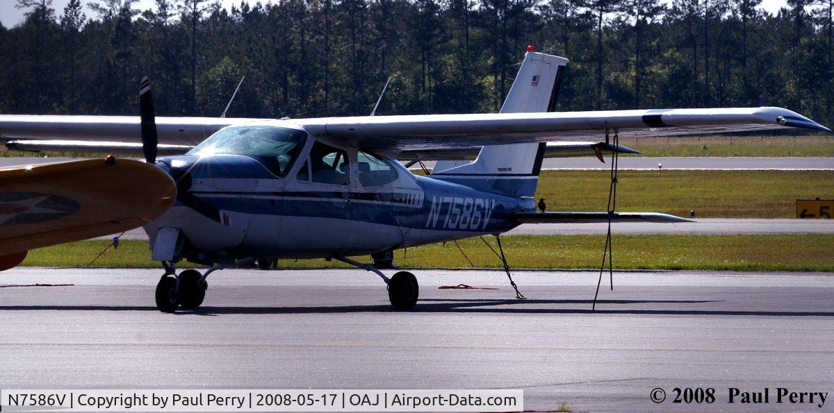 N7586V, 1976 Cessna 177RG Cardinal C/N 177RG0877, Clean Cessna nearly hidden by the warbird