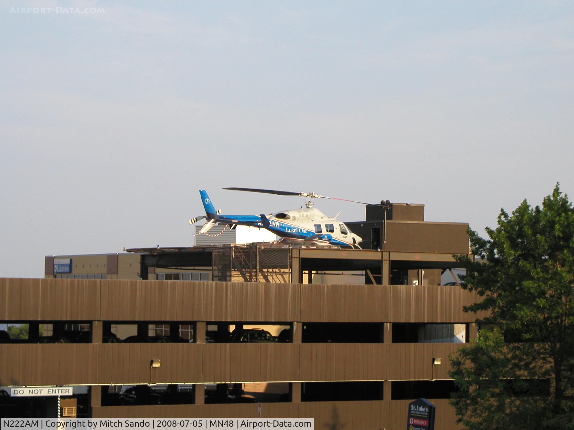 N222AM, 1986 Bell 222U C/N 47547, Luke's One on the pad at St. Luke's after an MVA in Solon Springs, WI which involved 3 helicopters.
