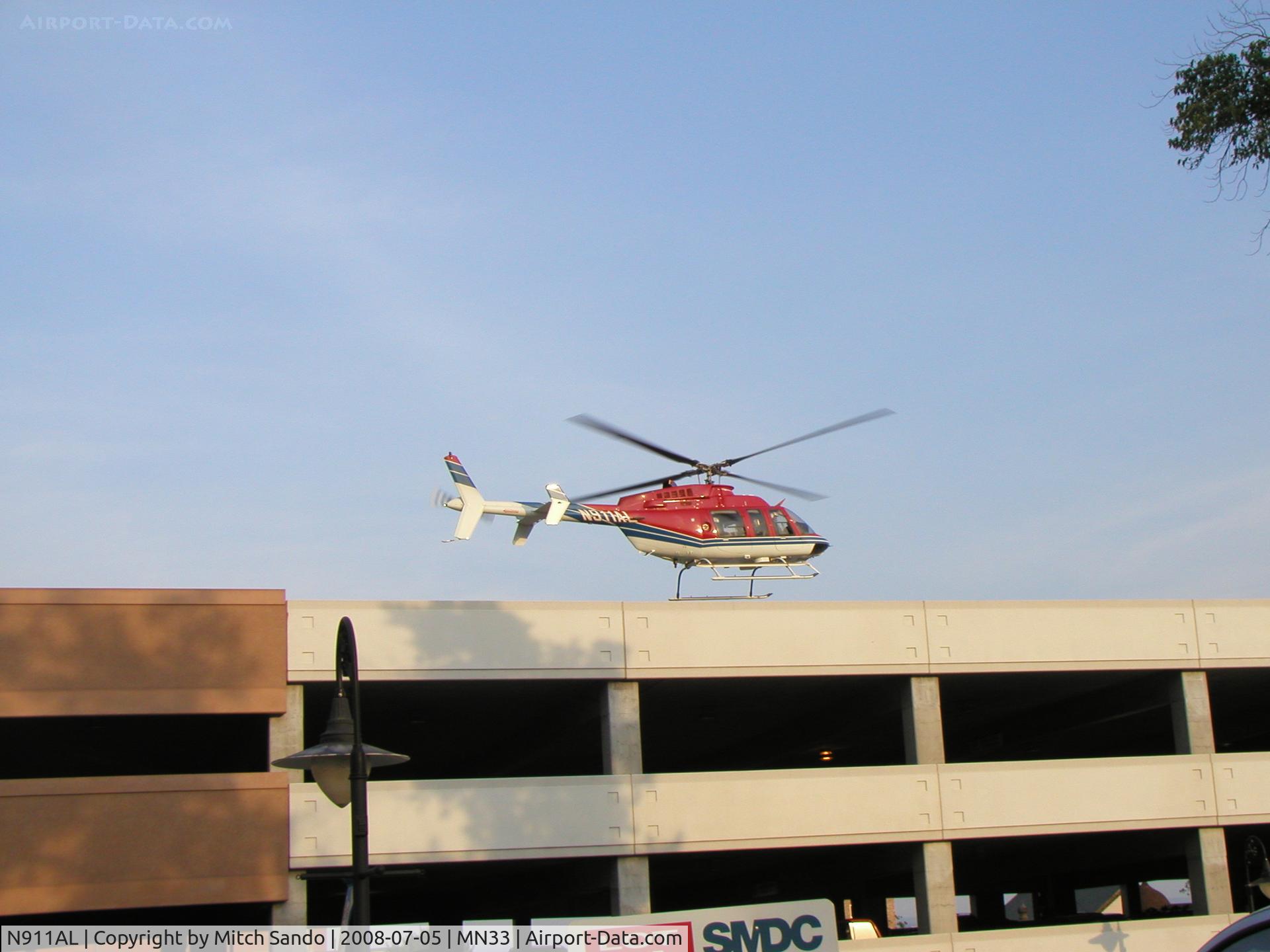 N911AL, 1997 Bell 407 C/N 53144, Life Link 5 departing the Alternate LZ at St. Mary's Duluth enroute VFR to Rice Lake, WI (RPD).