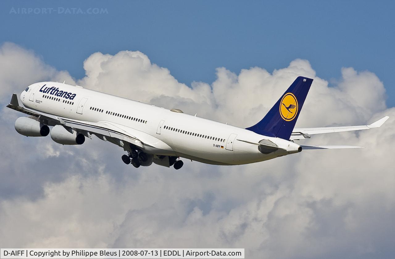 D-AIFF, 2001 Airbus A340-313X C/N 447, Climbing from rwy 23L through impressive clouds. Main gear on the move.