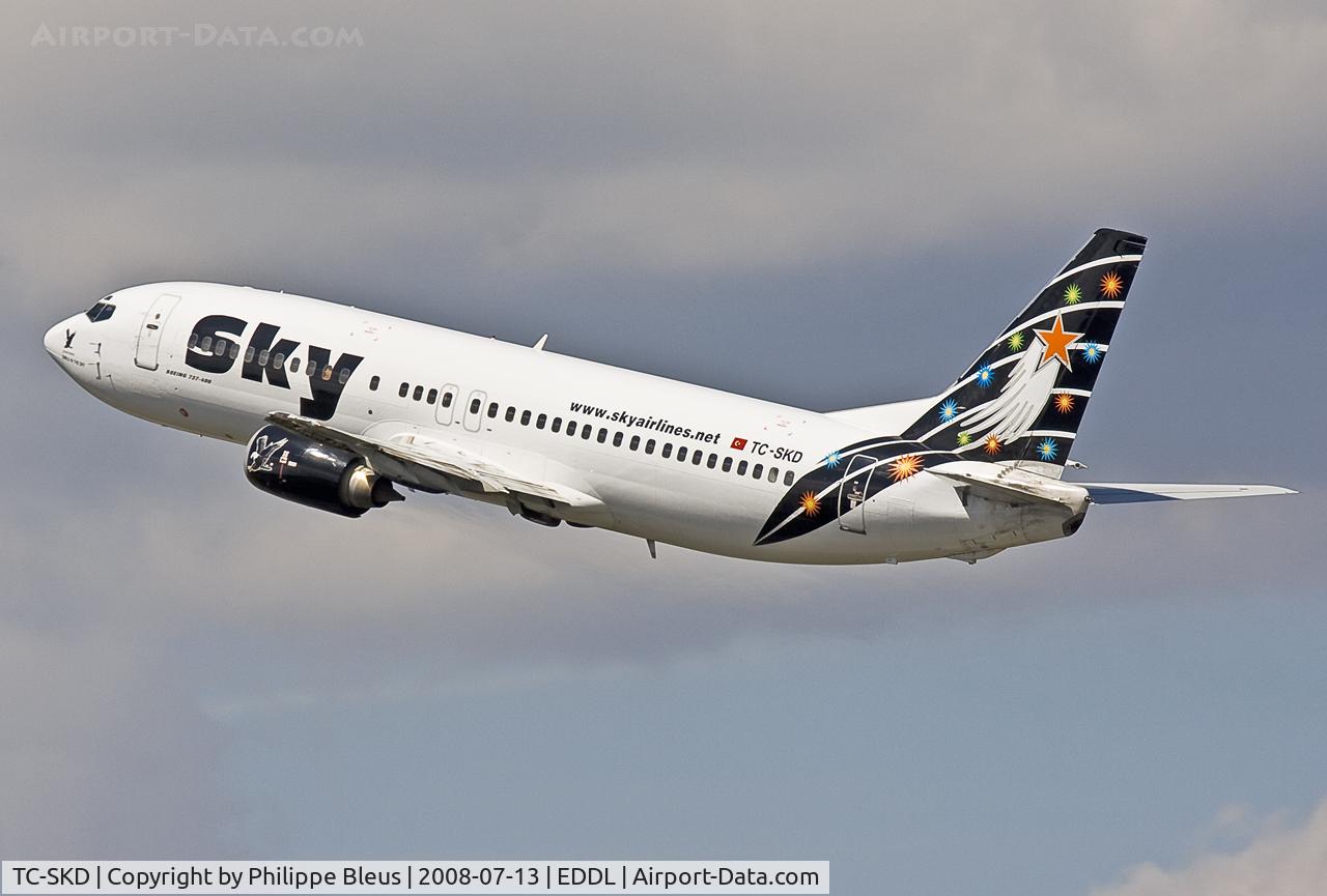 TC-SKD, 1992 Boeing 737-4Q8 C/N 25372, Climbing from rwy 23L through impressive clouds.