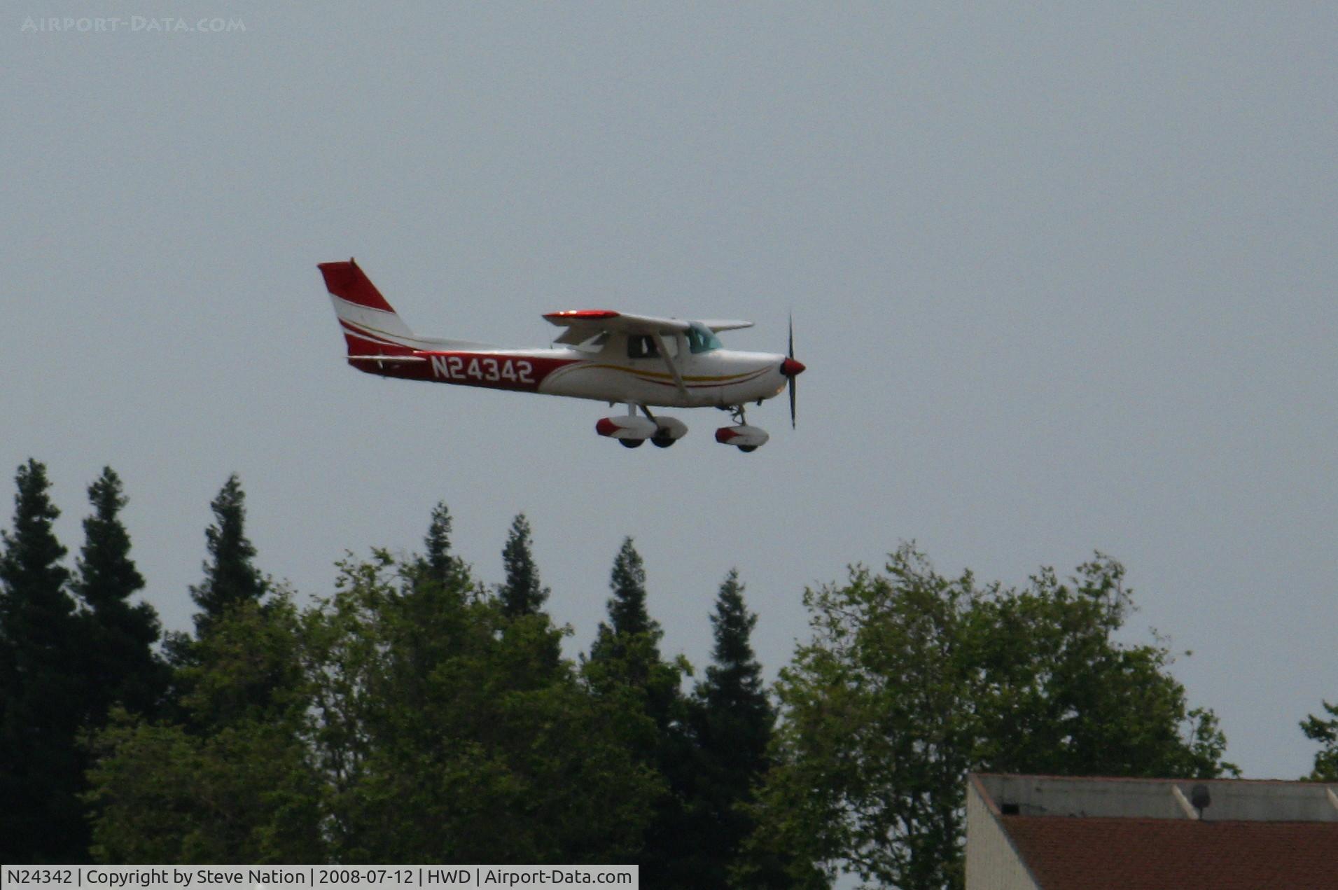 N24342, 1977 Cessna 152 C/N 15280227, 1977 Cessna 152 landing in smoky conditions @ Hayward Air Terminal, CA