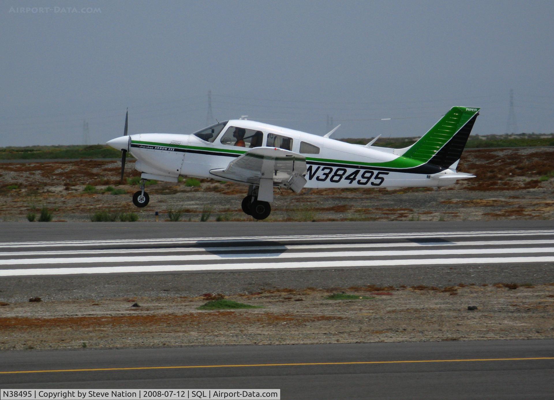 N38495, 1977 Piper PA-28R-201T Cherokee Arrow III C/N 28R-7703229, Nicely painted 1977 Piper PA-28R-201T touching down in smoky conditions @ San Carlos, CA