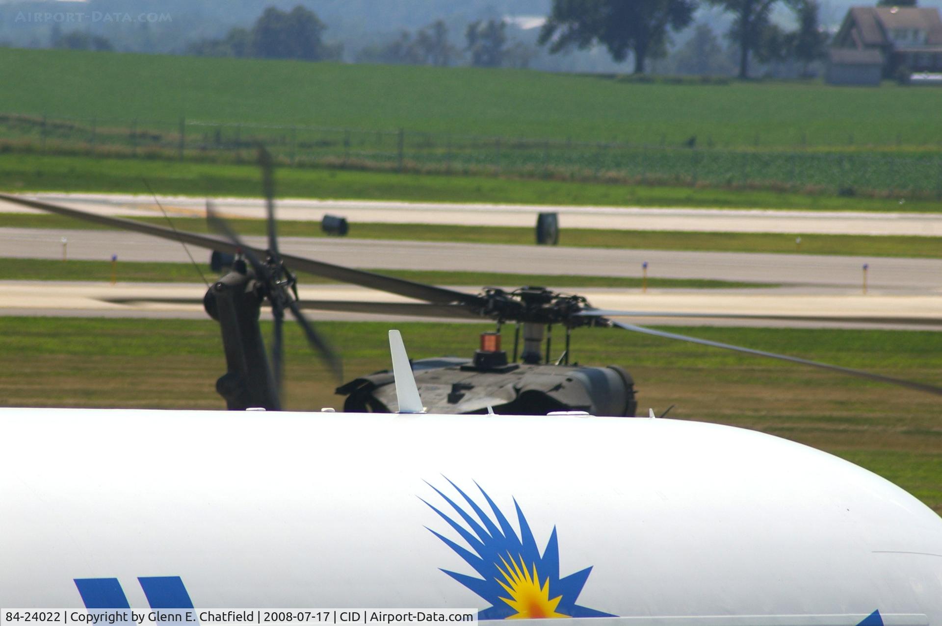 84-24022, 1986 Sikorsky EH-60A Black Hawk C/N 70-969, EH-60A taxiing for departure, passing in front of MD83.  I thought the shot was sort of a neat view of the rotor plane