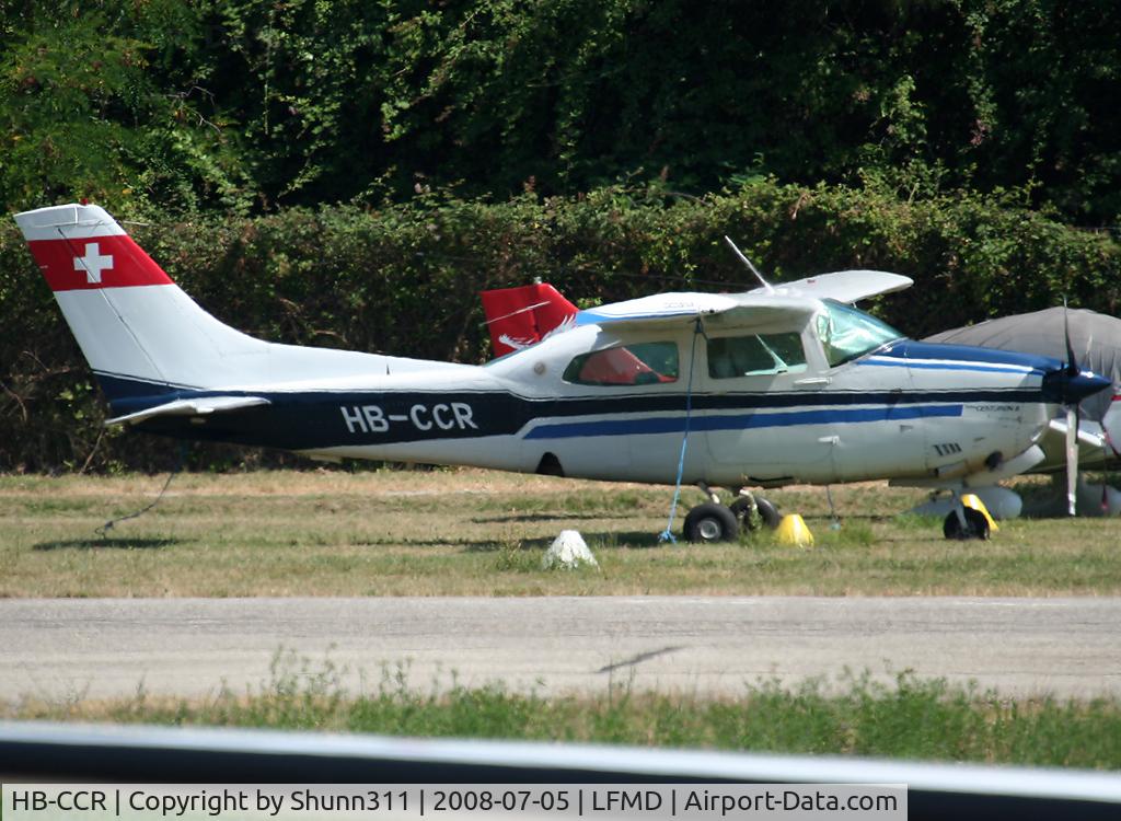 HB-CCR, 1979 Cessna T210N Turbo Centurion C/N T21063489, Parked in the grass...