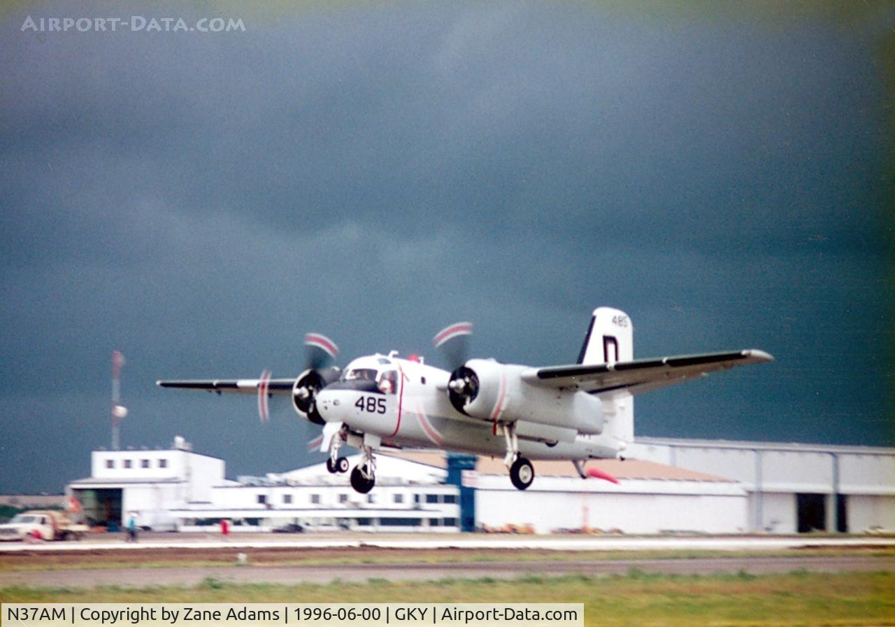 N37AM, 1959 Grumman US-2B Tracker (G89) C/N 340, Approaching storms causes a fast departure from Arlington Municipal Open House