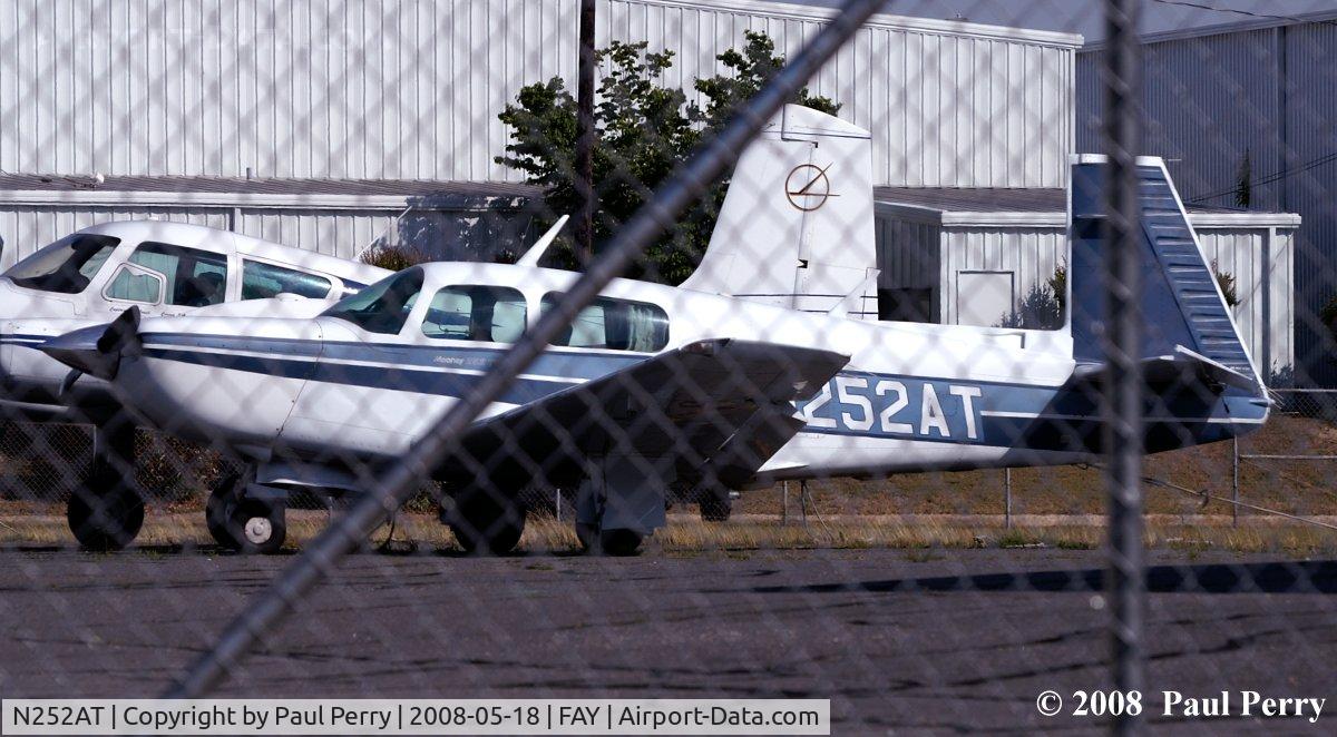 N252AT, 1985 Mooney M20K C/N 25-1007, Mooney and a fence, par for the course