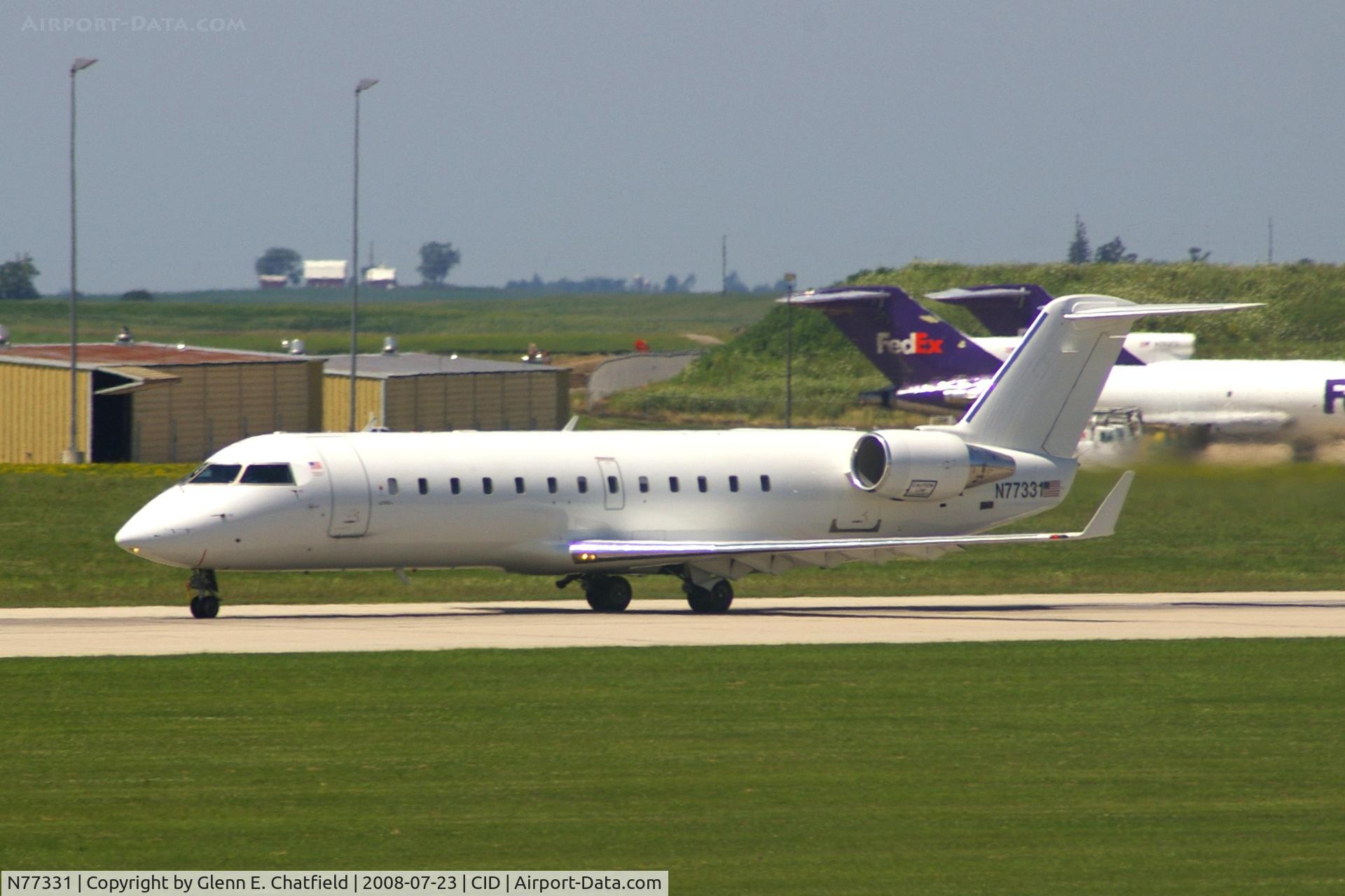 N77331, 1999 Bombardier CRJ-200LR (CL-600-2B19) C/N 7331, Seen from my office window, departing runway 13