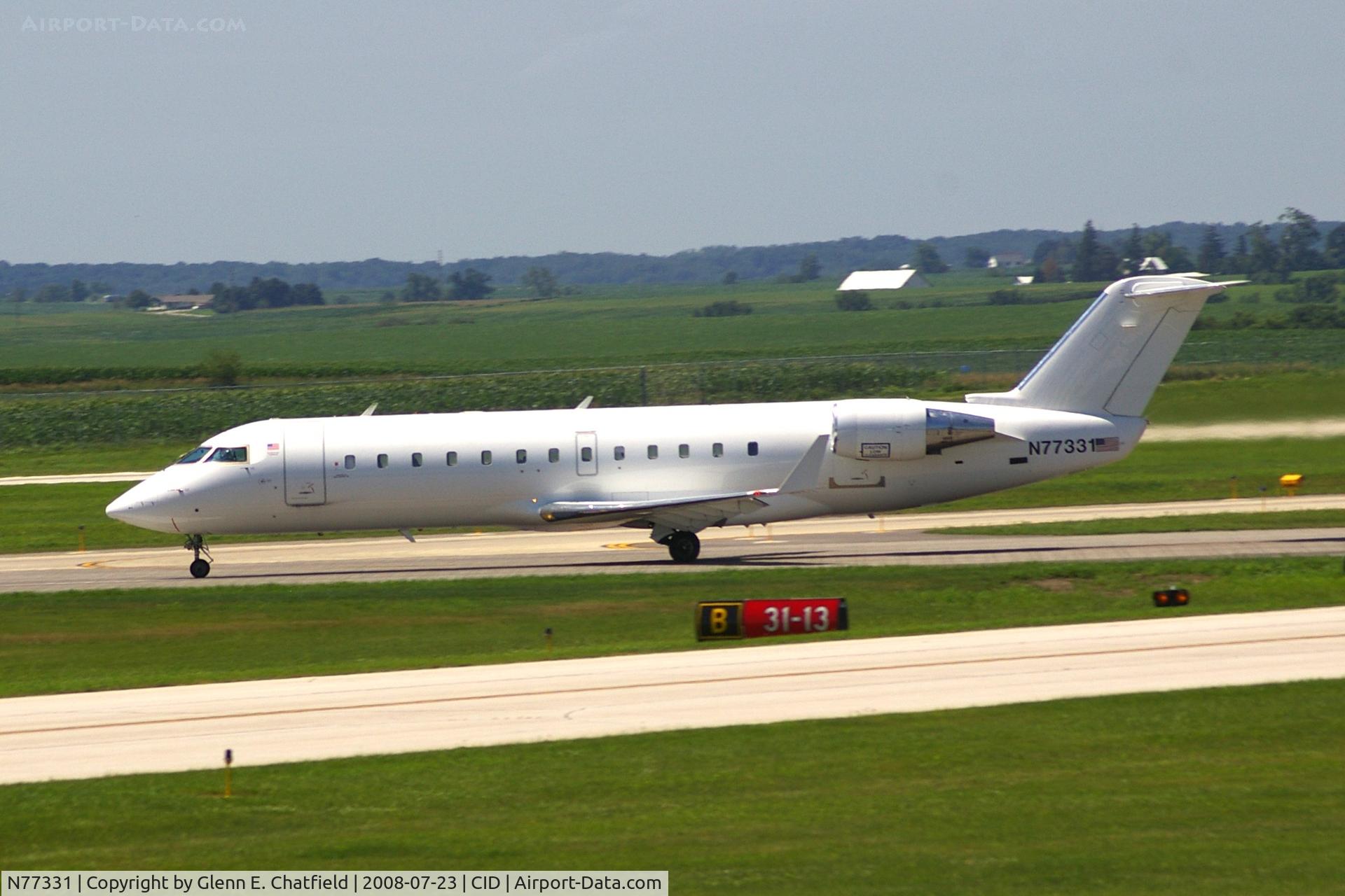 N77331, 1999 Bombardier CRJ-200LR (CL-600-2B19) C/N 7331, Seen from my office window, departing runway 13