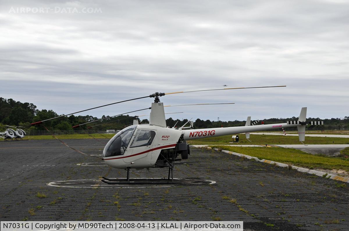 N7031G, 1998 Robinson R22 BETA C/N 2855, Resting at the ramp.