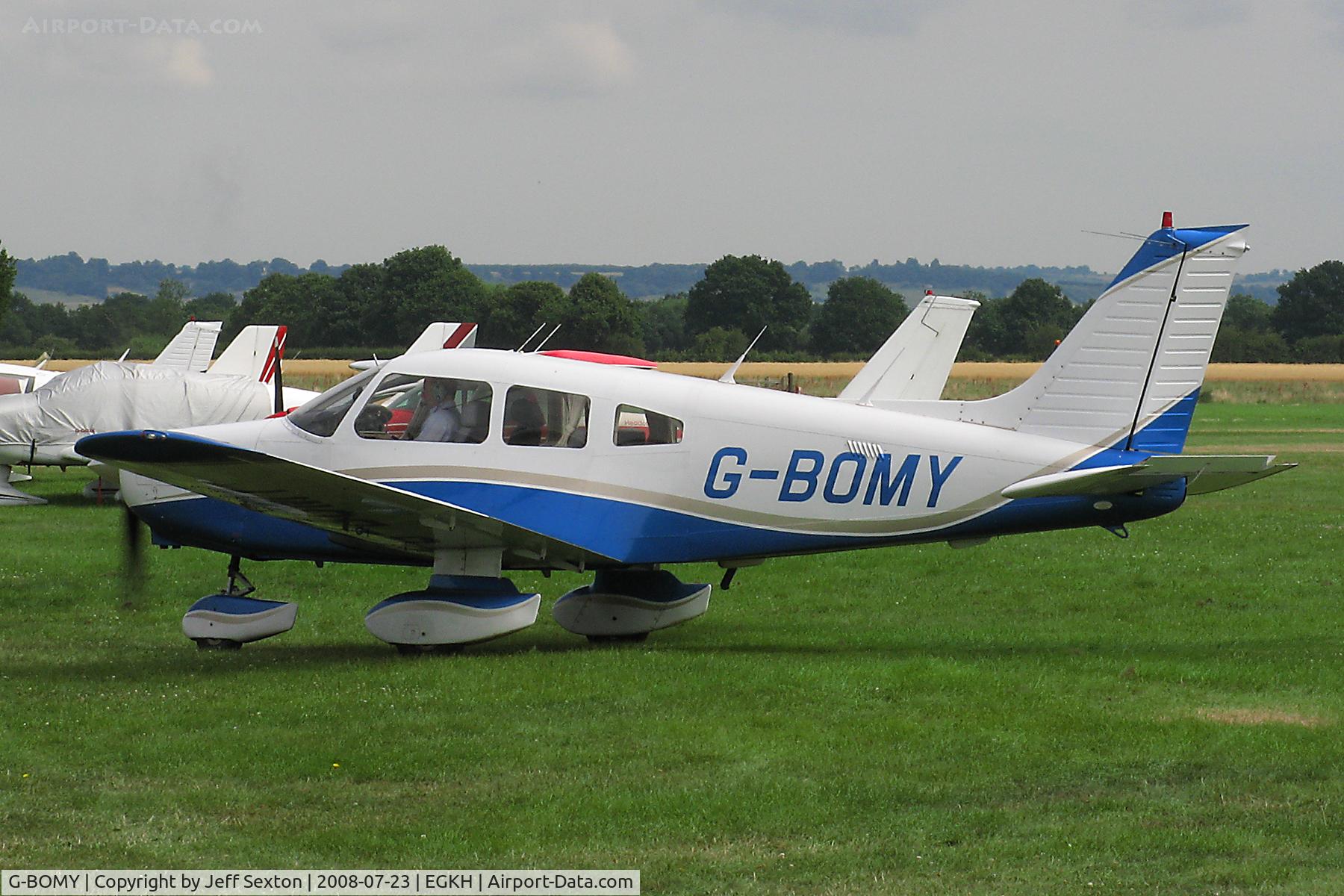 G-BOMY, 1982 Piper PA-28-161 Cherokee Warrior II C/N 28-8216049, Taxiing out from flight line at Lashenden/Headcorn