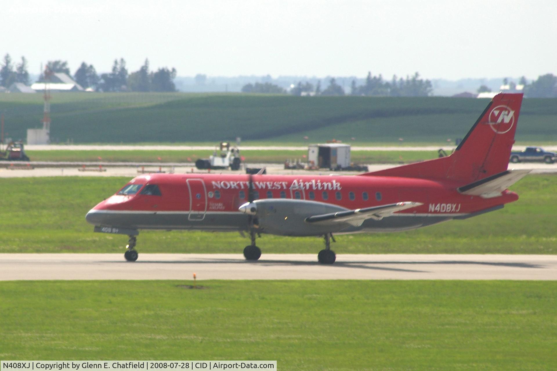 N408XJ, 1996 Saab 340B C/N 340B-408, Take-off roll on Runway 13. Seen from second floor window of the control tower.