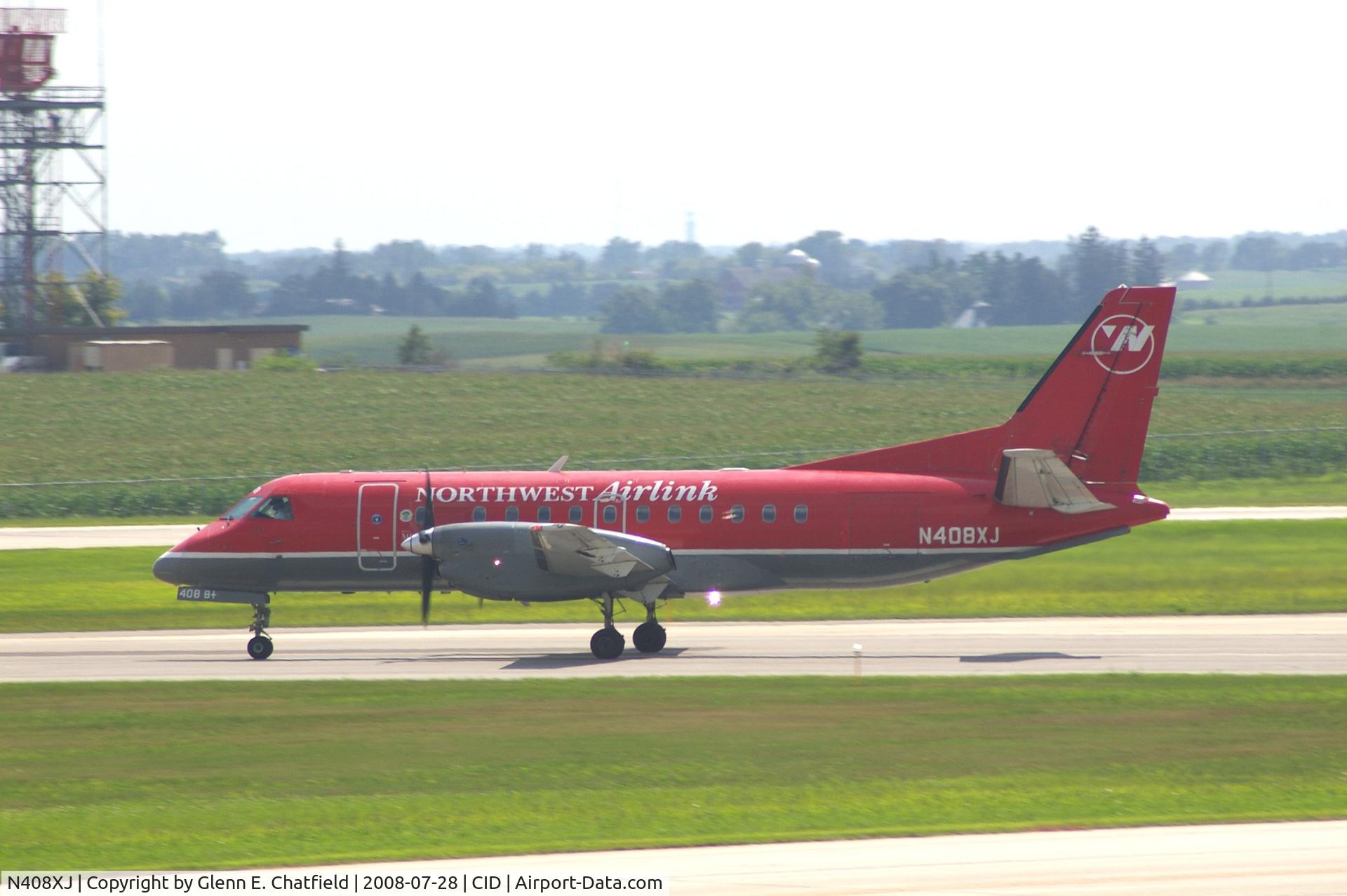 N408XJ, 1996 Saab 340B C/N 340B-408, Take-off roll on Runway 13. Seen from second floor window of the control tower.