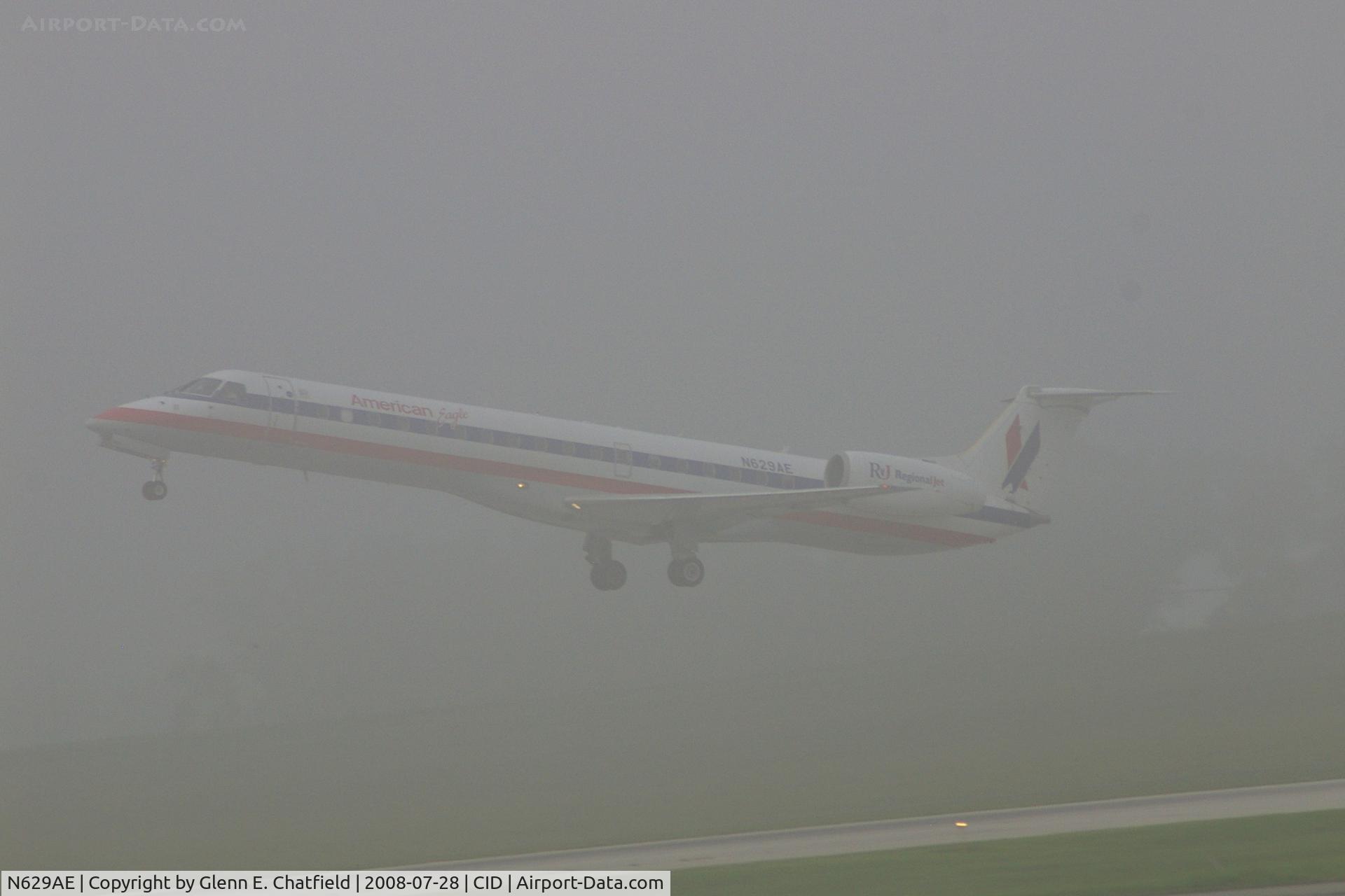 N629AE, 1999 Embraer ERJ-145LR (EMB-145LR) C/N 145130, Departing runway 9 in the early morning fog.  Seen from my office window on the second floor of the control tower.