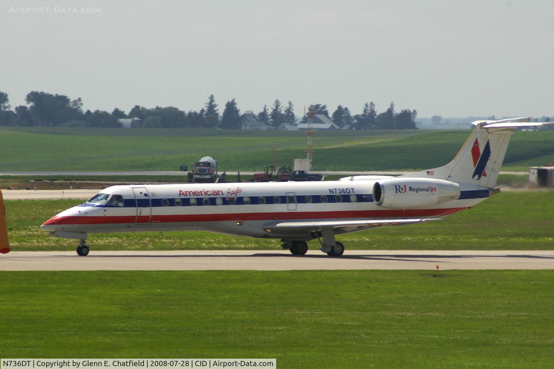 N736DT, 2001 Embraer ERJ-135LR (EMB-135LR) C/N 145388, Take-off roll on Runway 13. Seen from second floor window of the control tower.