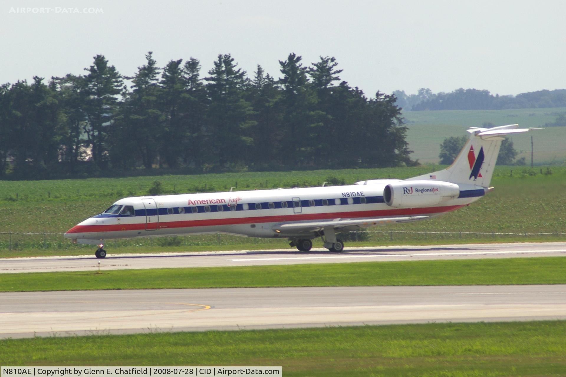 N810AE, 2001 Embraer ERJ-140LR (EMB-135KL) C/N 145525, Rolling out on Runway 9, seen from my office window.