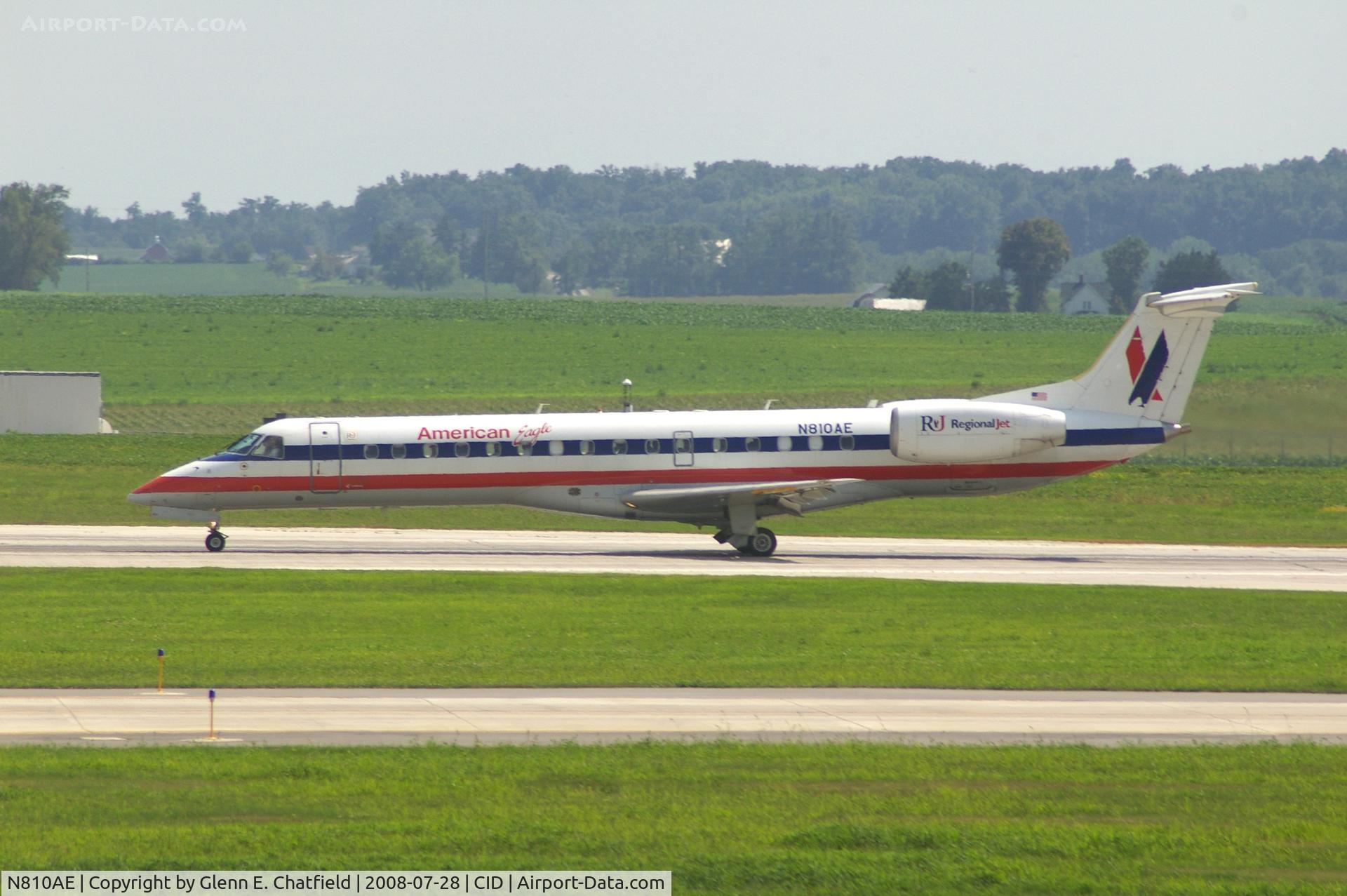 N810AE, 2001 Embraer ERJ-140LR (EMB-135KL) C/N 145525, Rolling out on Runway 9, seen from my office window.