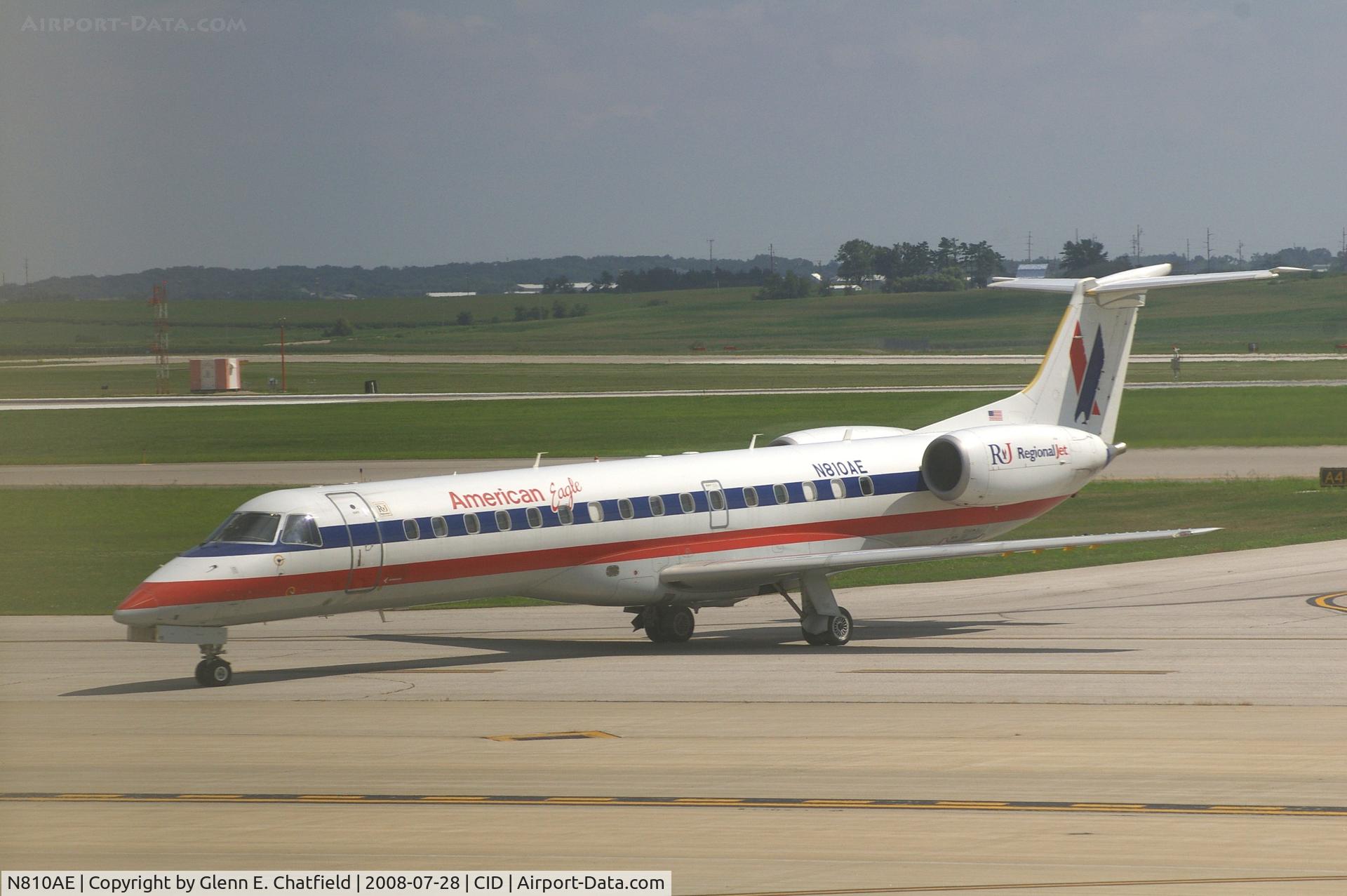 N810AE, 2001 Embraer ERJ-140LR (EMB-135KL) C/N 145525, Taxiing on Alpha to the ramp.  Looking through my dirty window.