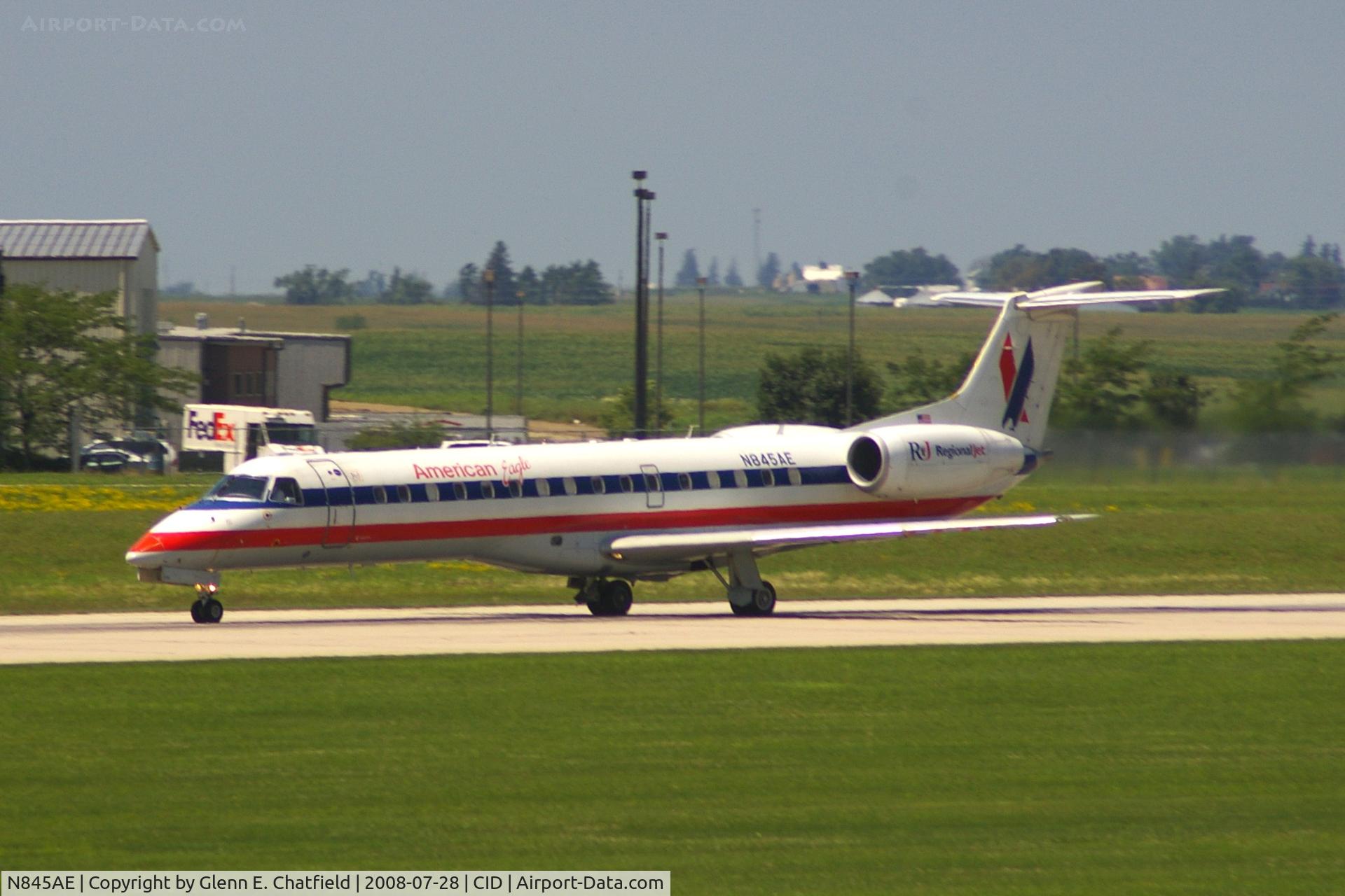 N845AE, 2003 Embraer ERJ-140LR (EMB-135KL) C/N 145685, Take-off roll on Runway 13. Seen from second floor window of the control tower.