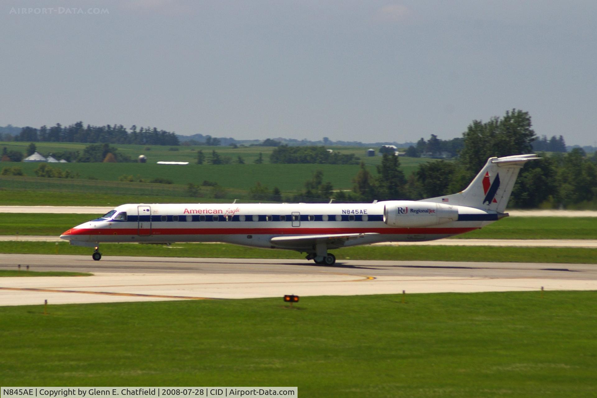 N845AE, 2003 Embraer ERJ-140LR (EMB-135KL) C/N 145685, Take-off roll on Runway 13. Seen from second floor window of the control tower.