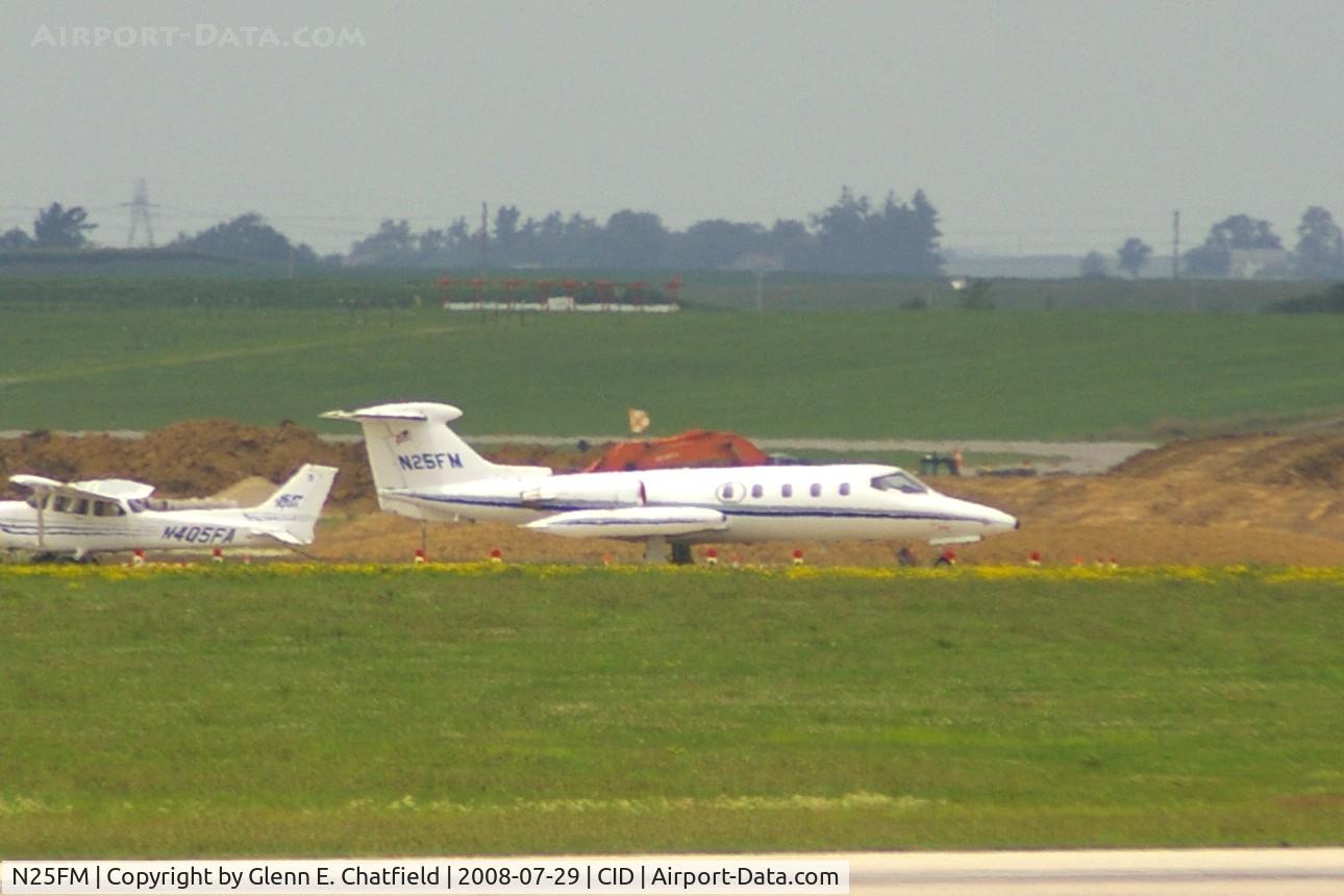 N25FM, 1970 Gates Learjet 25 C/N 25-063, Sitting way on the west side, seen from my dirty office window in the control tower.