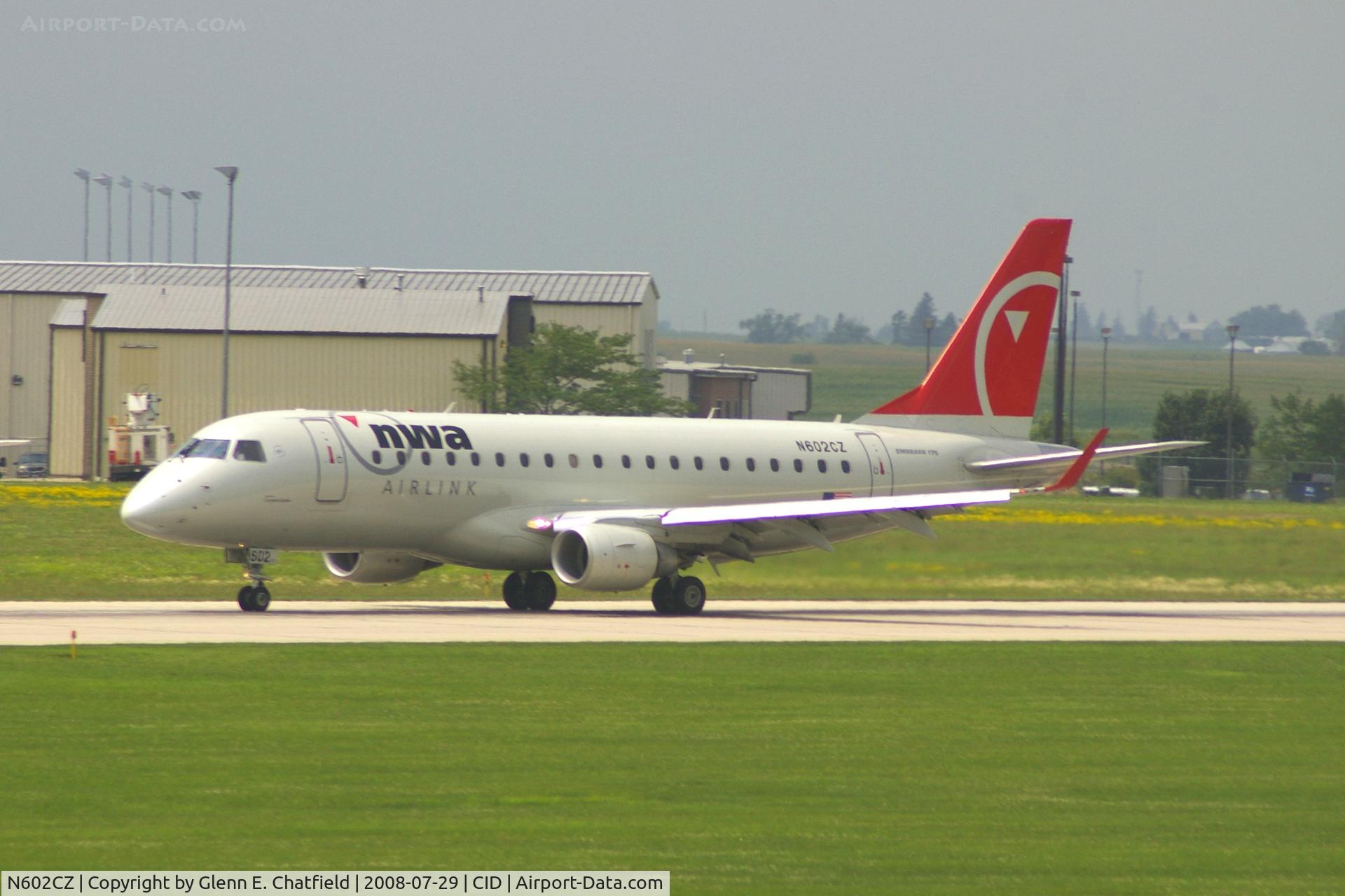 N602CZ, 2007 Embraer 175LR (ERJ-170-200LR) C/N 17000171, Take-off roll on Runway 13. Seen from second floor window of the control tower.